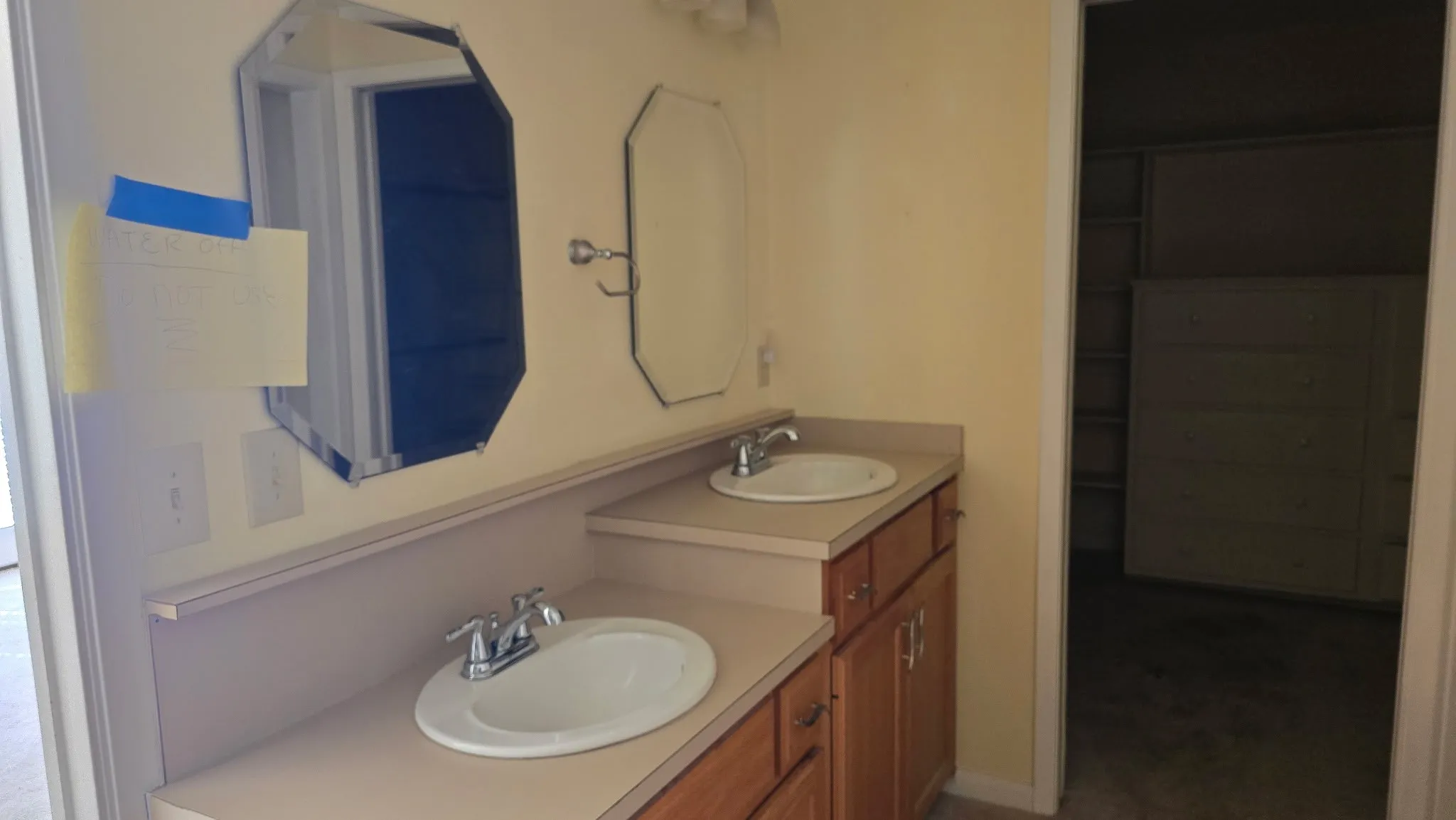 Dual vanity with integrated sinks and chrome fixtures