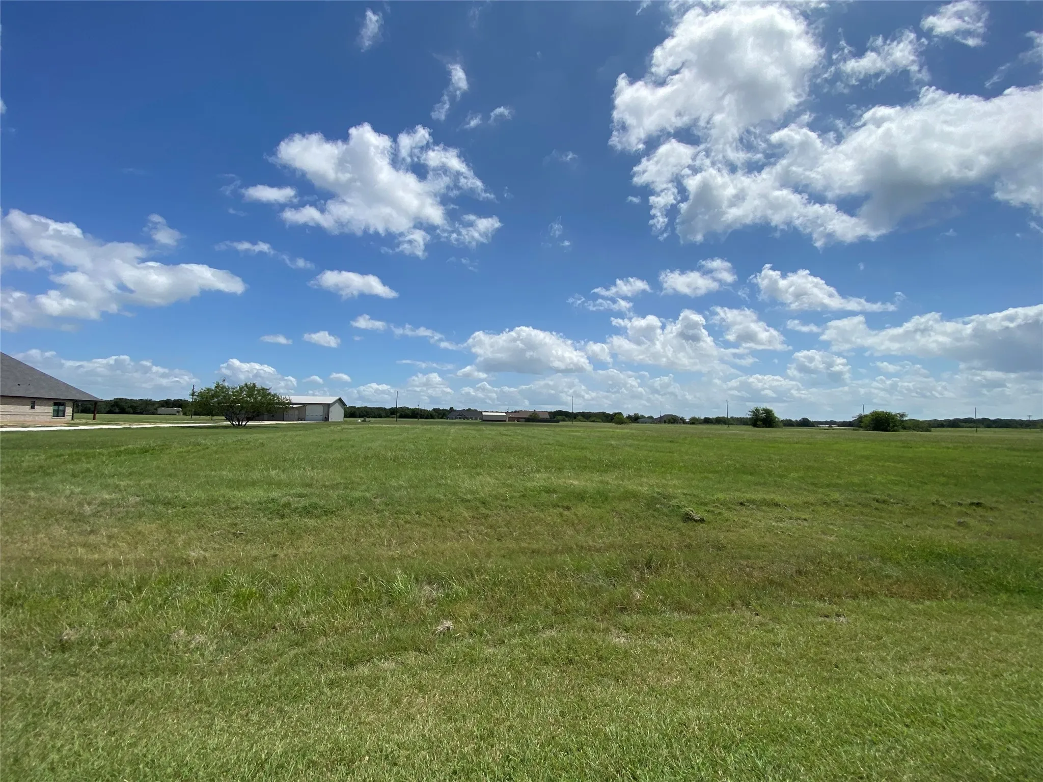 View of yard with a rural view