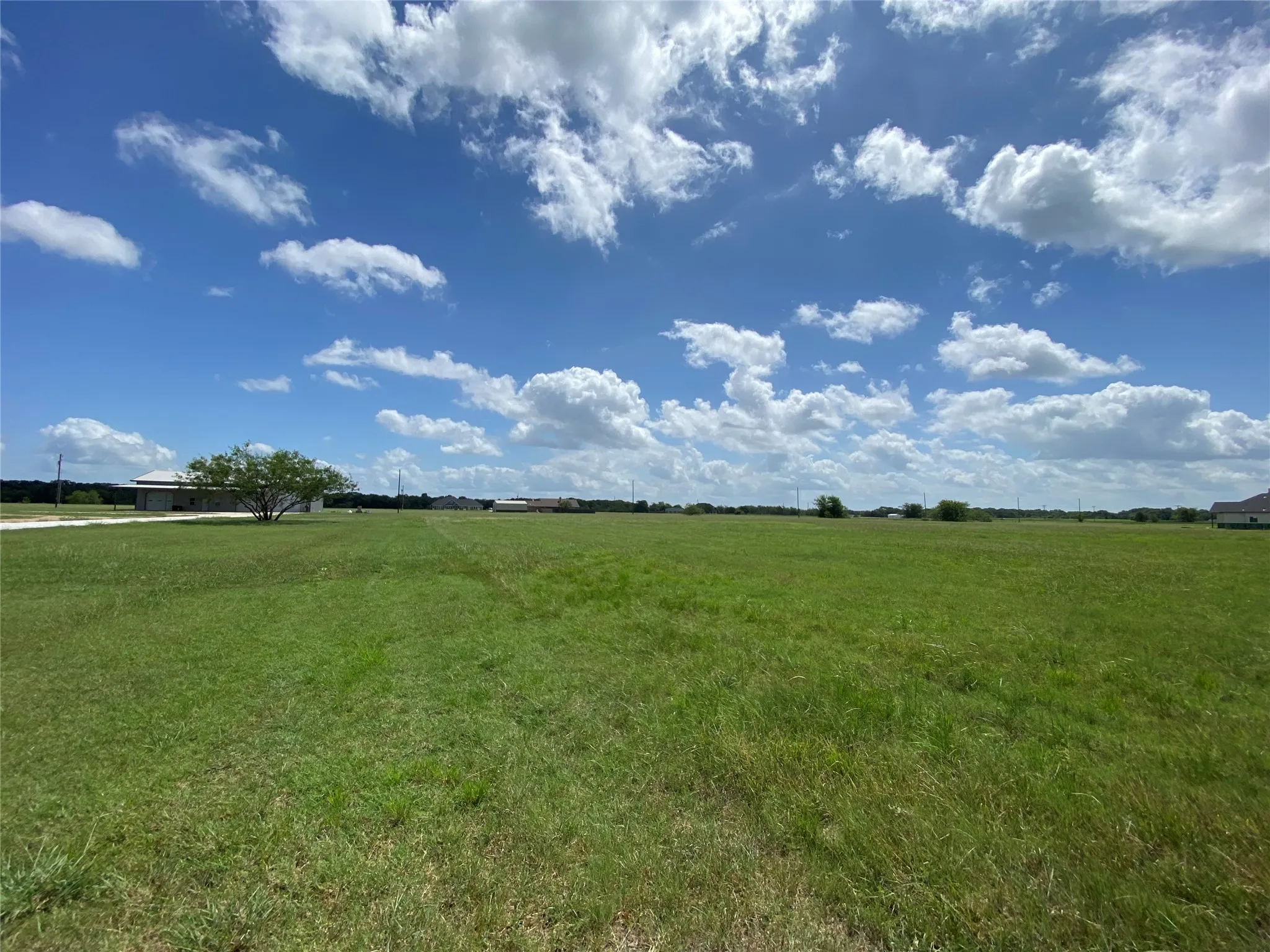 View of yard with a rural view