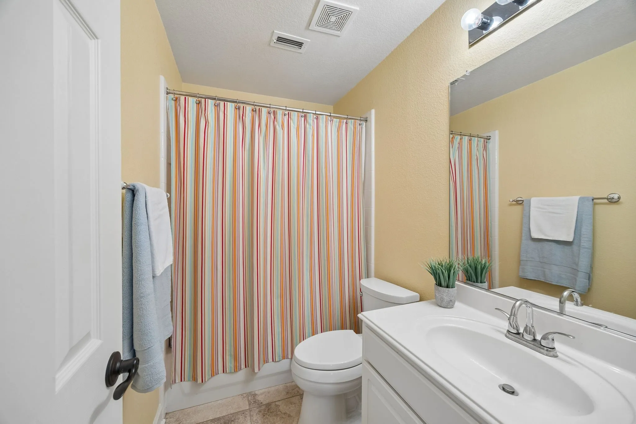 A full secondary bathroom conveniently serves the additional bedrooms.