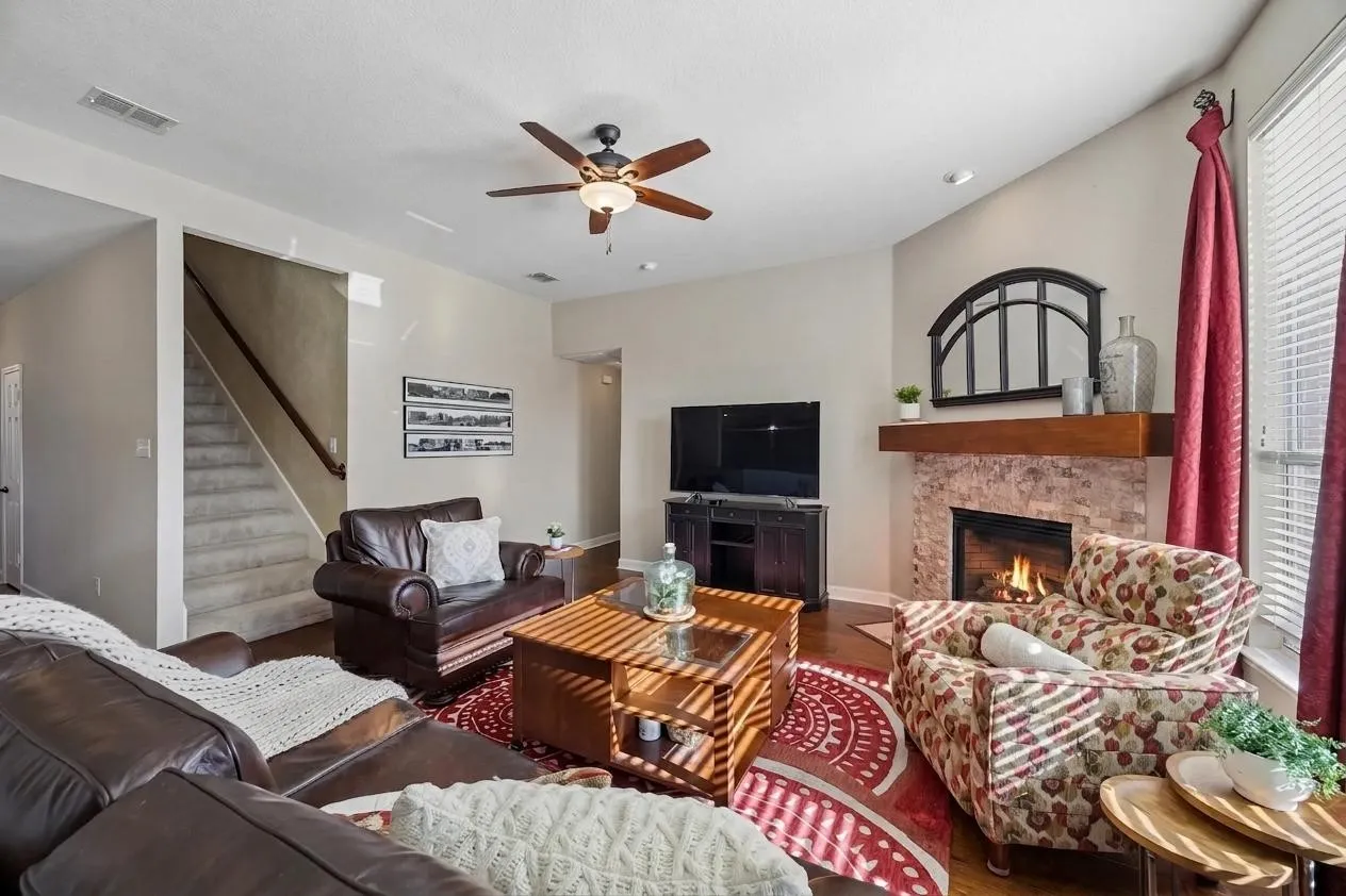 The fireplace was refreshed with an updated tile surround and mantel.