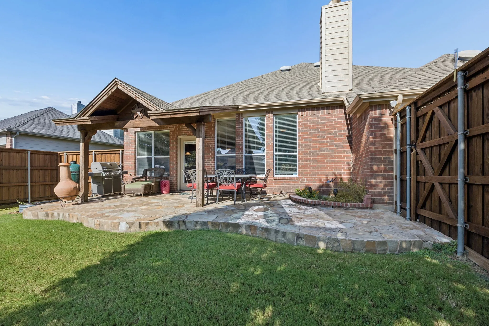 The covered flagstone patio was designed for grilling, entertaining and relaxing outdoors.