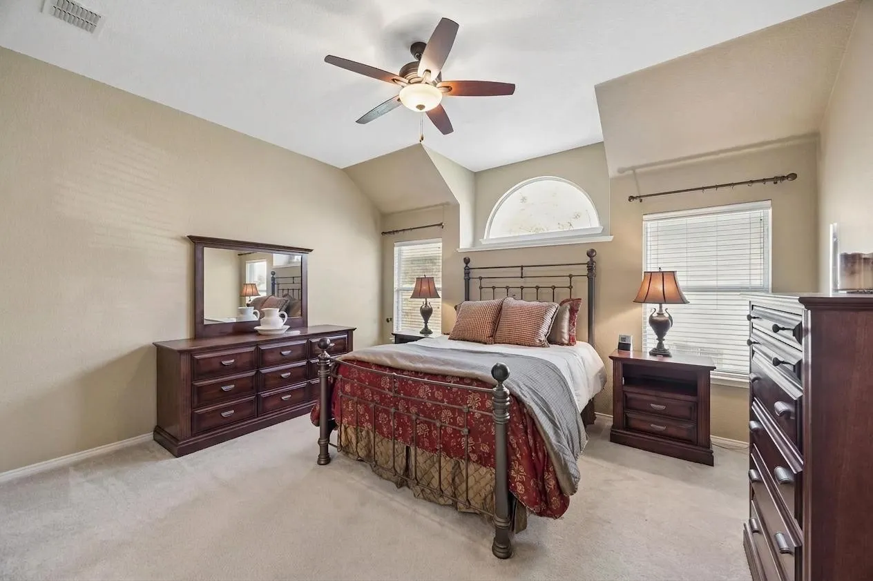 The spacious primary bedroom is located on the main level.