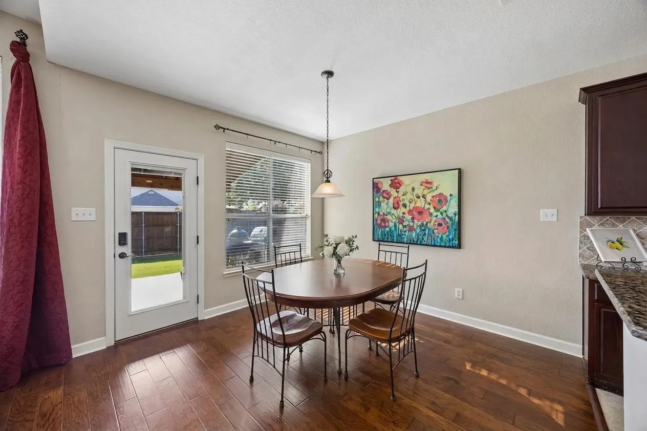 Open to the kitchen and family room, with direct access to the amazing covered patio.