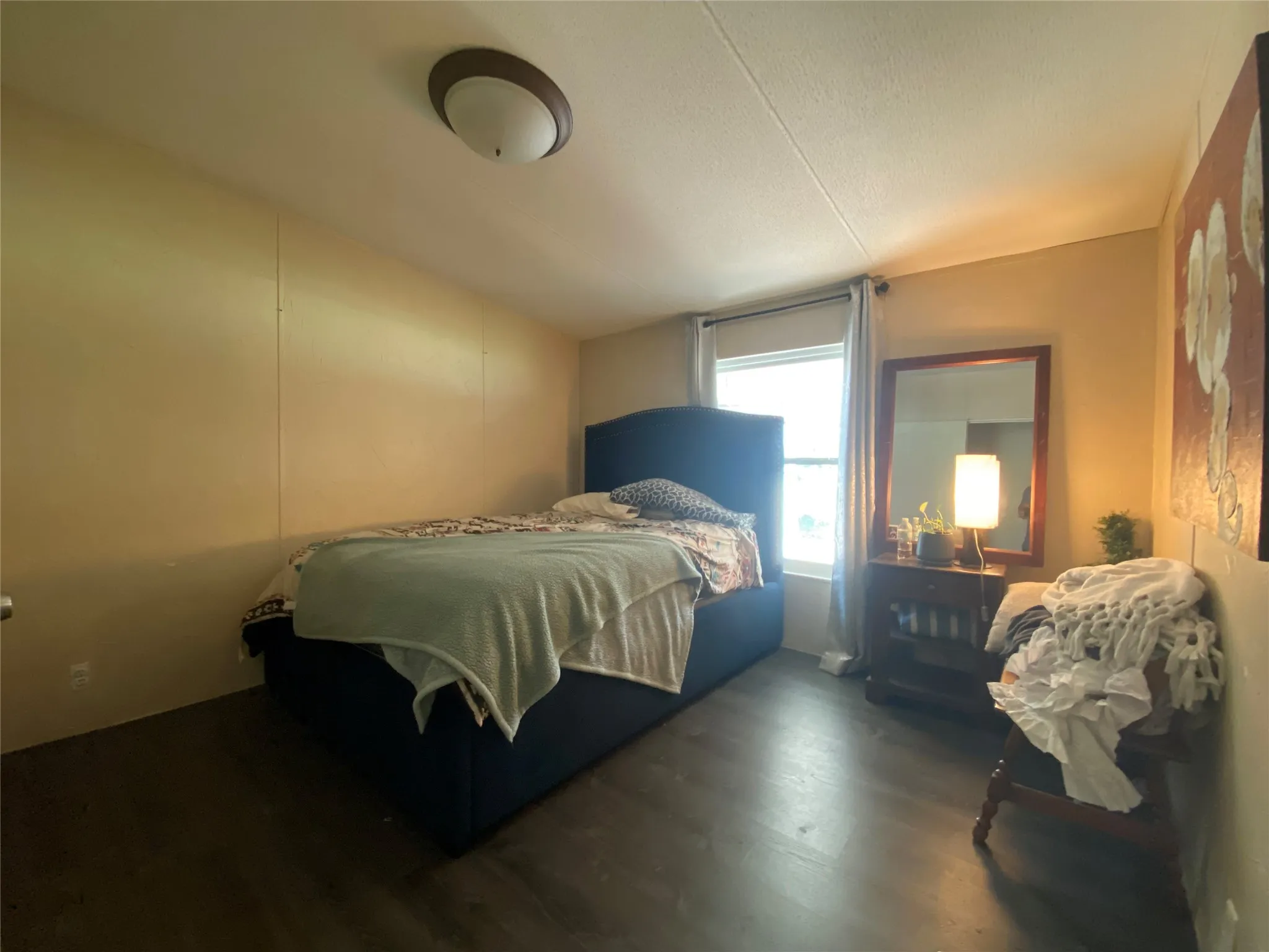 Bedroom featuring dark wood finished floors
