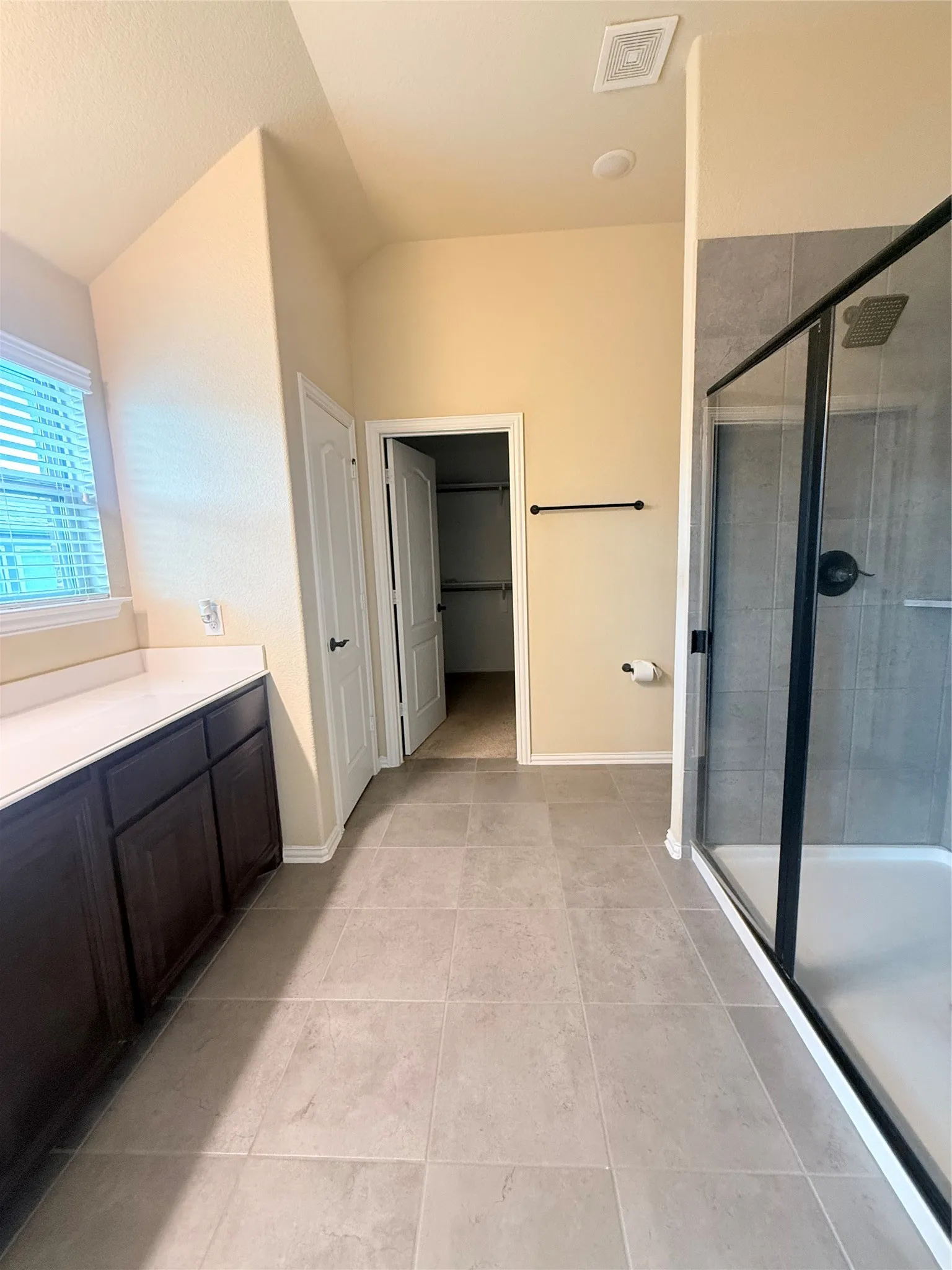 Spacious bathroom featuring large format floor tiling