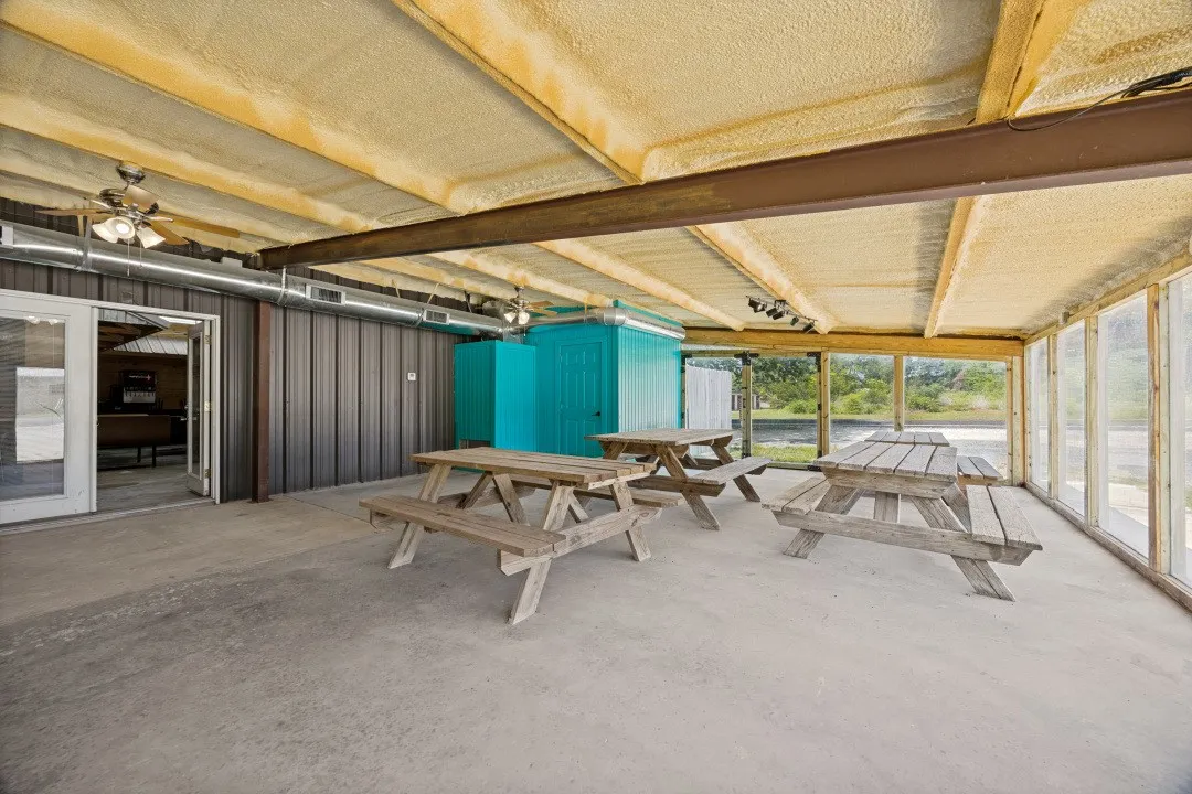 25x61 meeting room surrounded with windows.