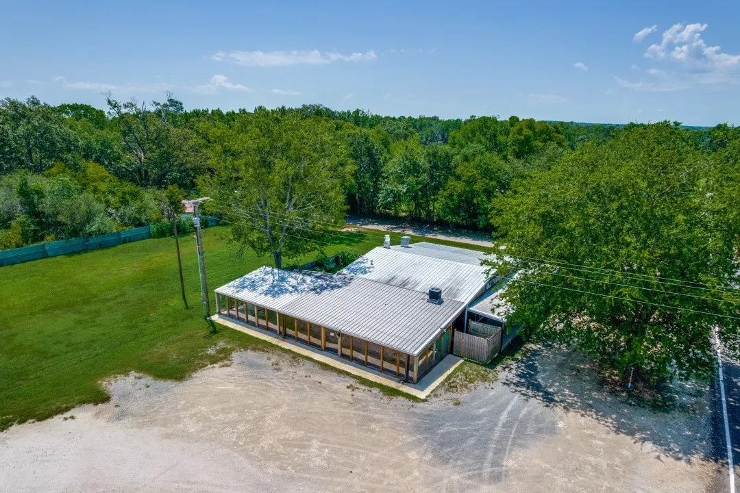 Drone view of side of building and parking