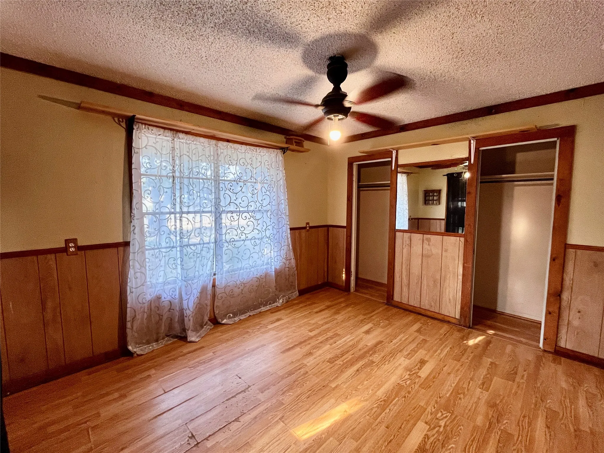 Front bedroom has his and hers closets, or can be used as a dedicated office space or book nook.