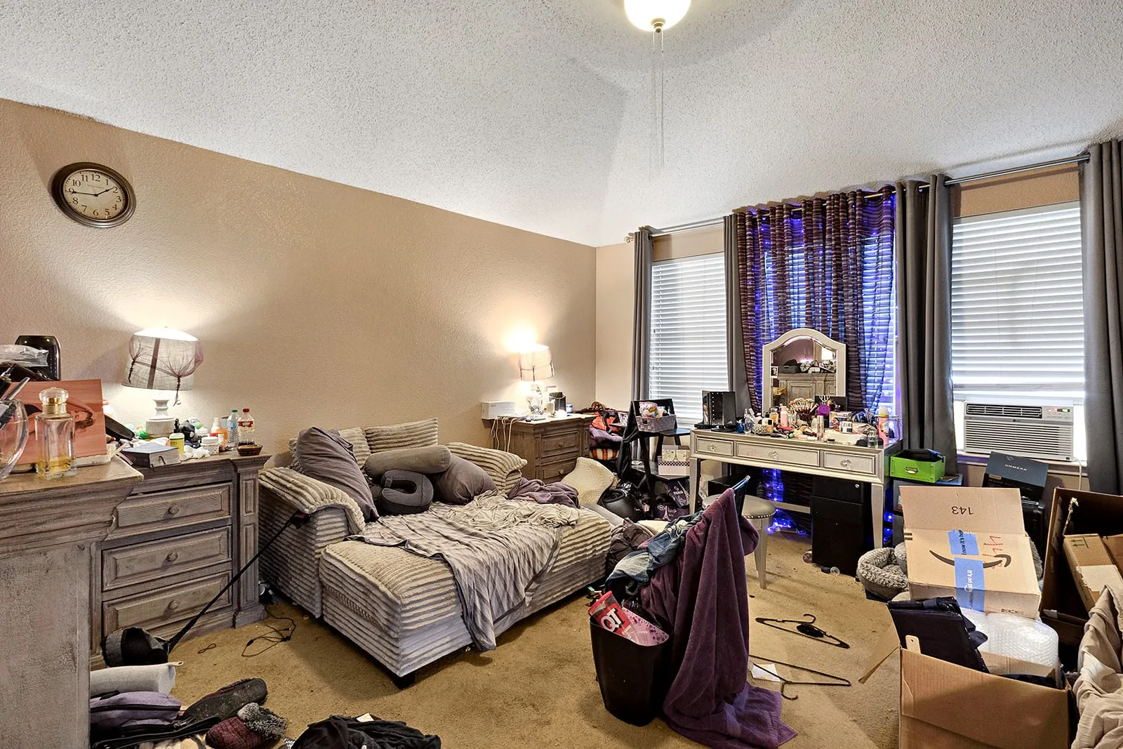 Carpeted interior space with vaulted ceilings