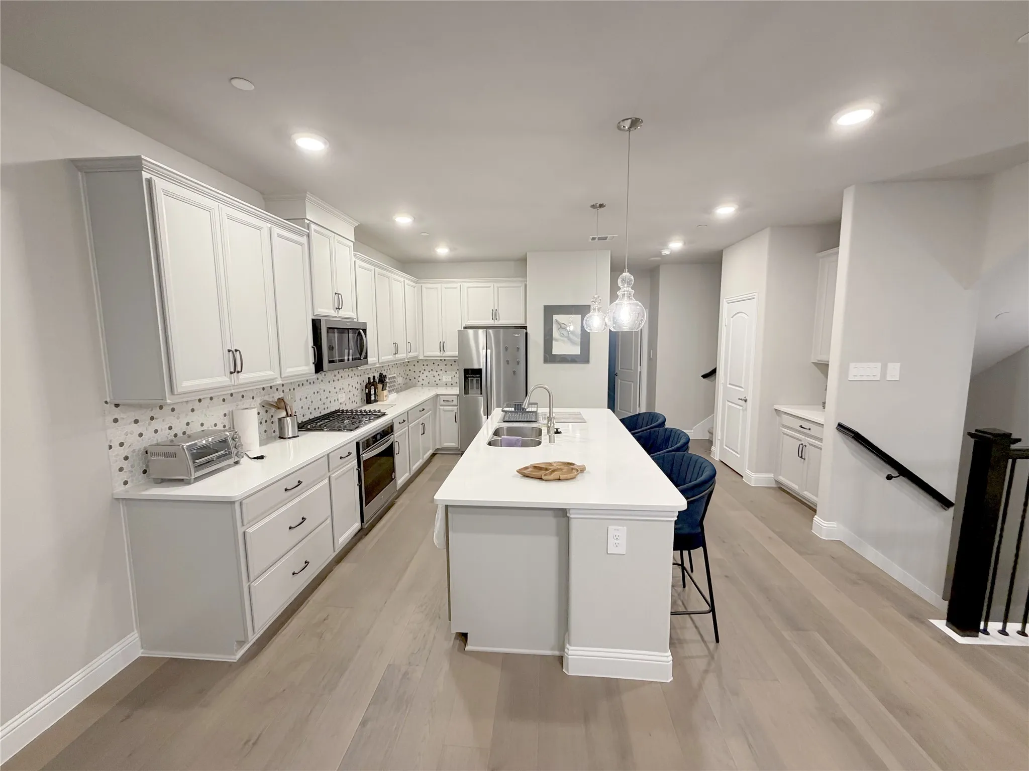 fully equipped kitchen with new appliances.