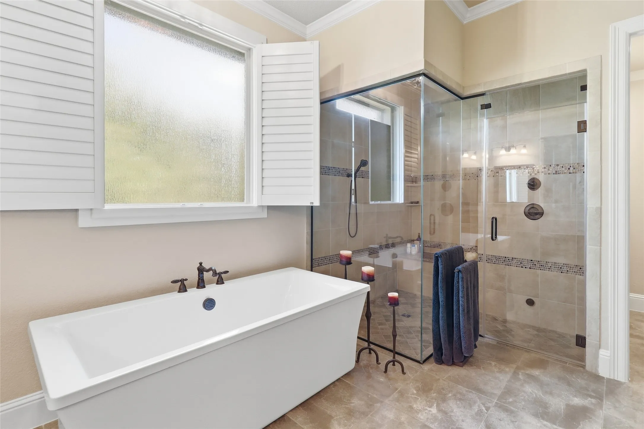 Primary Bathroom is upgraded to an over-sized STEAM SHOWER with double shower heads.