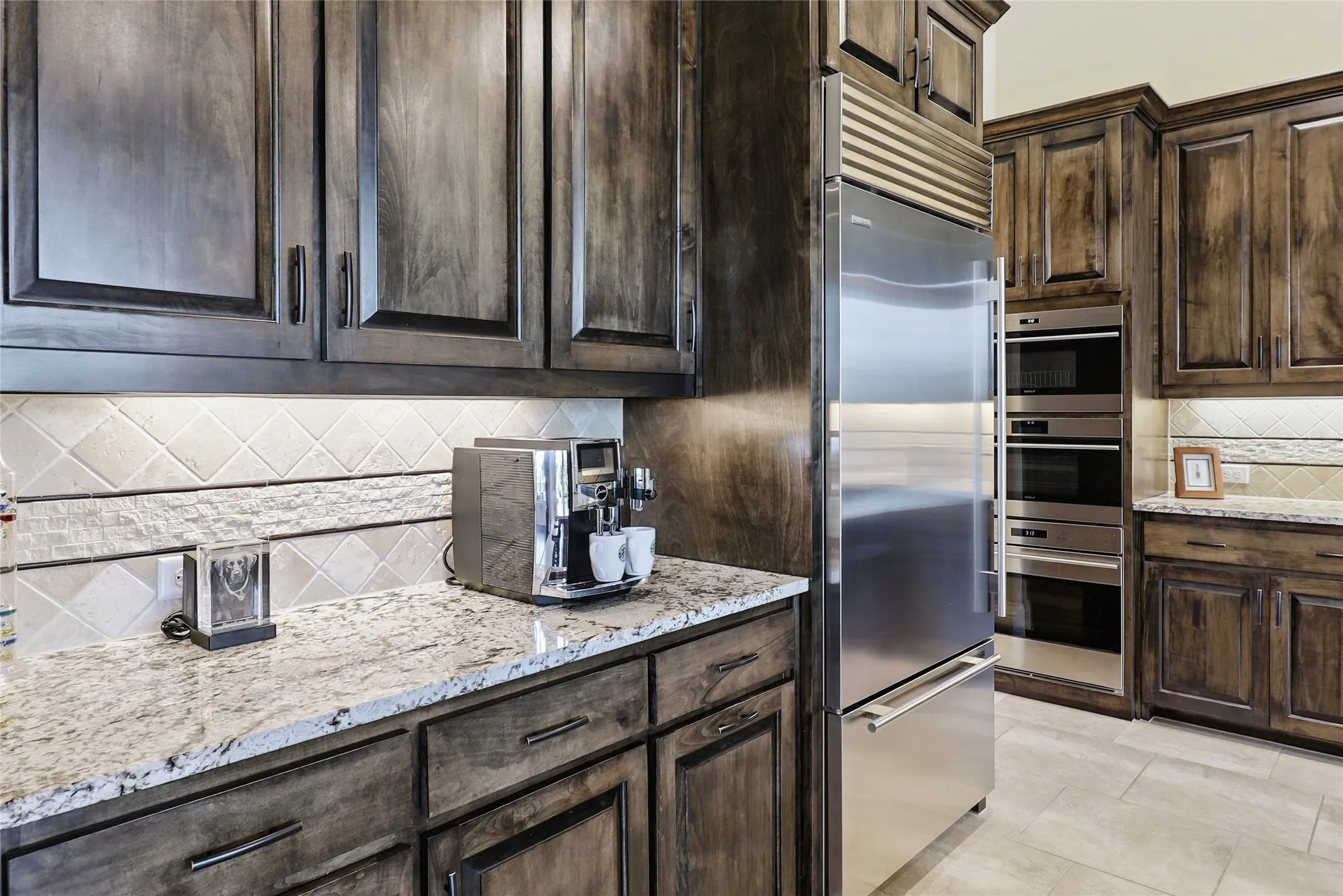 Completely upgraded Wolf refrigerator and 3 ovens (microwave, steam, and conventional oven with convection feature).