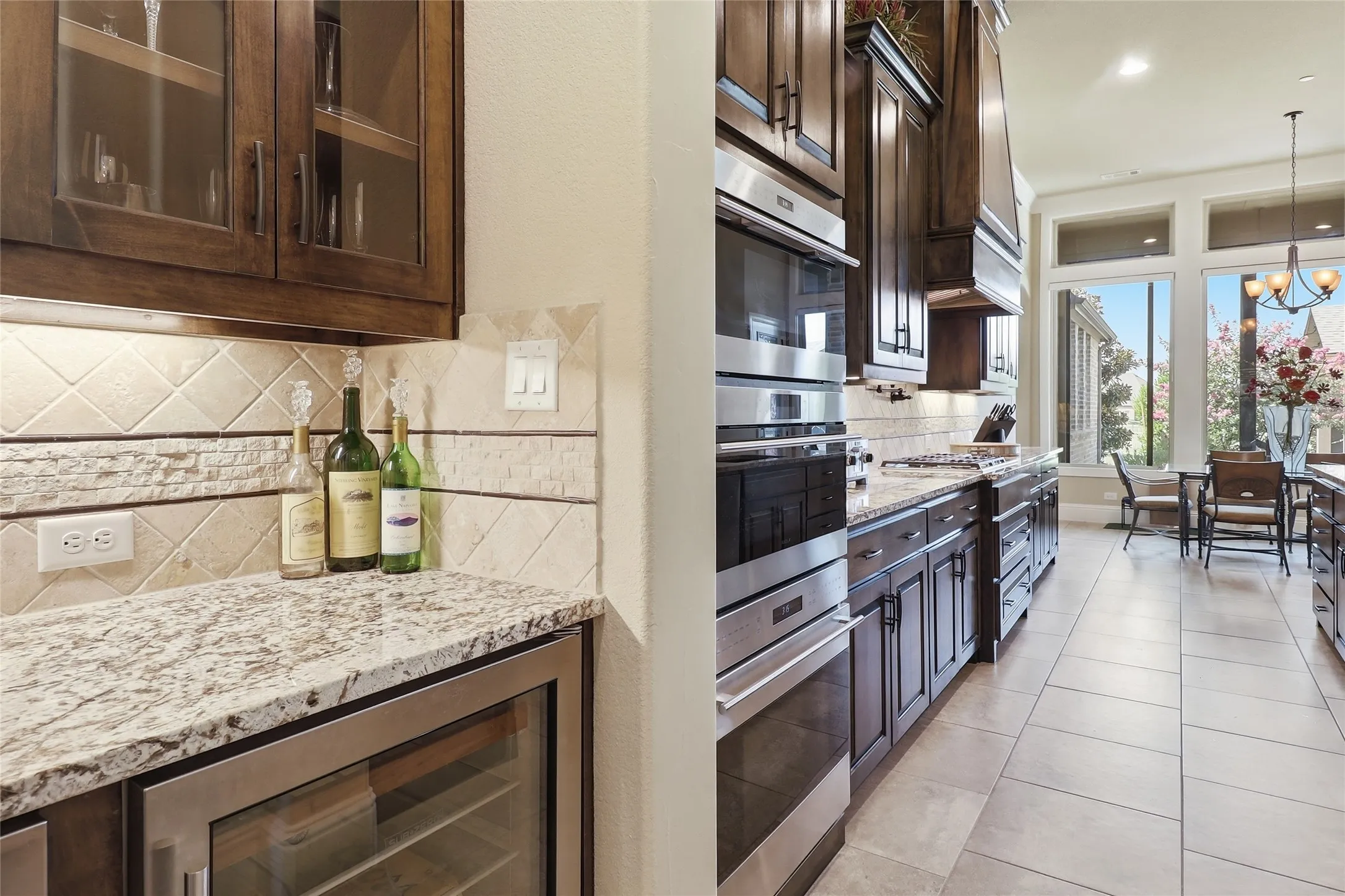 From the butler's pantry through the extensively upgraded kitchen, the view to the natural outdoors is exquisite.