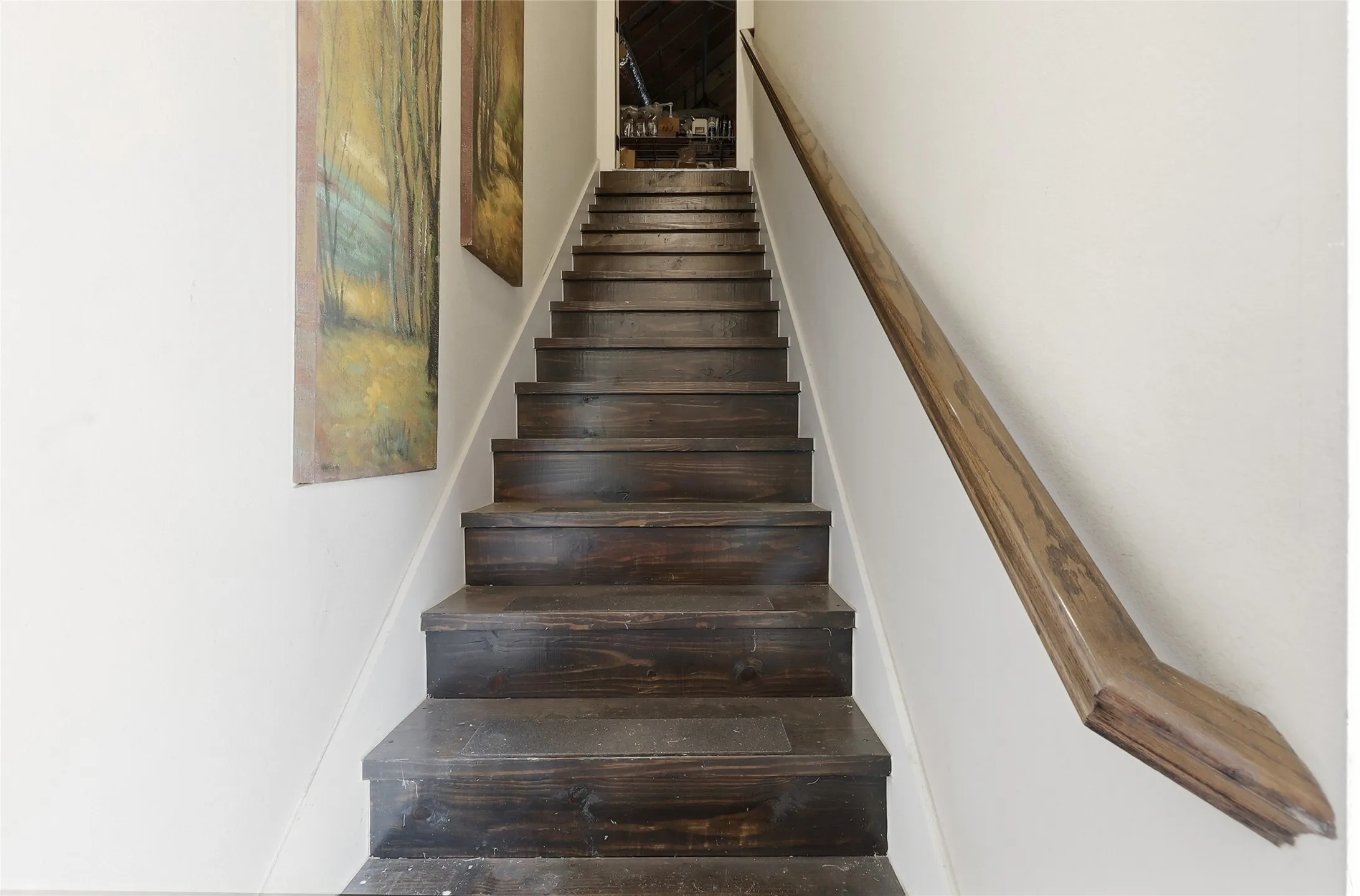 Private staircase from garage area  to fully floored storage/work-are above 3-car oversized garage.