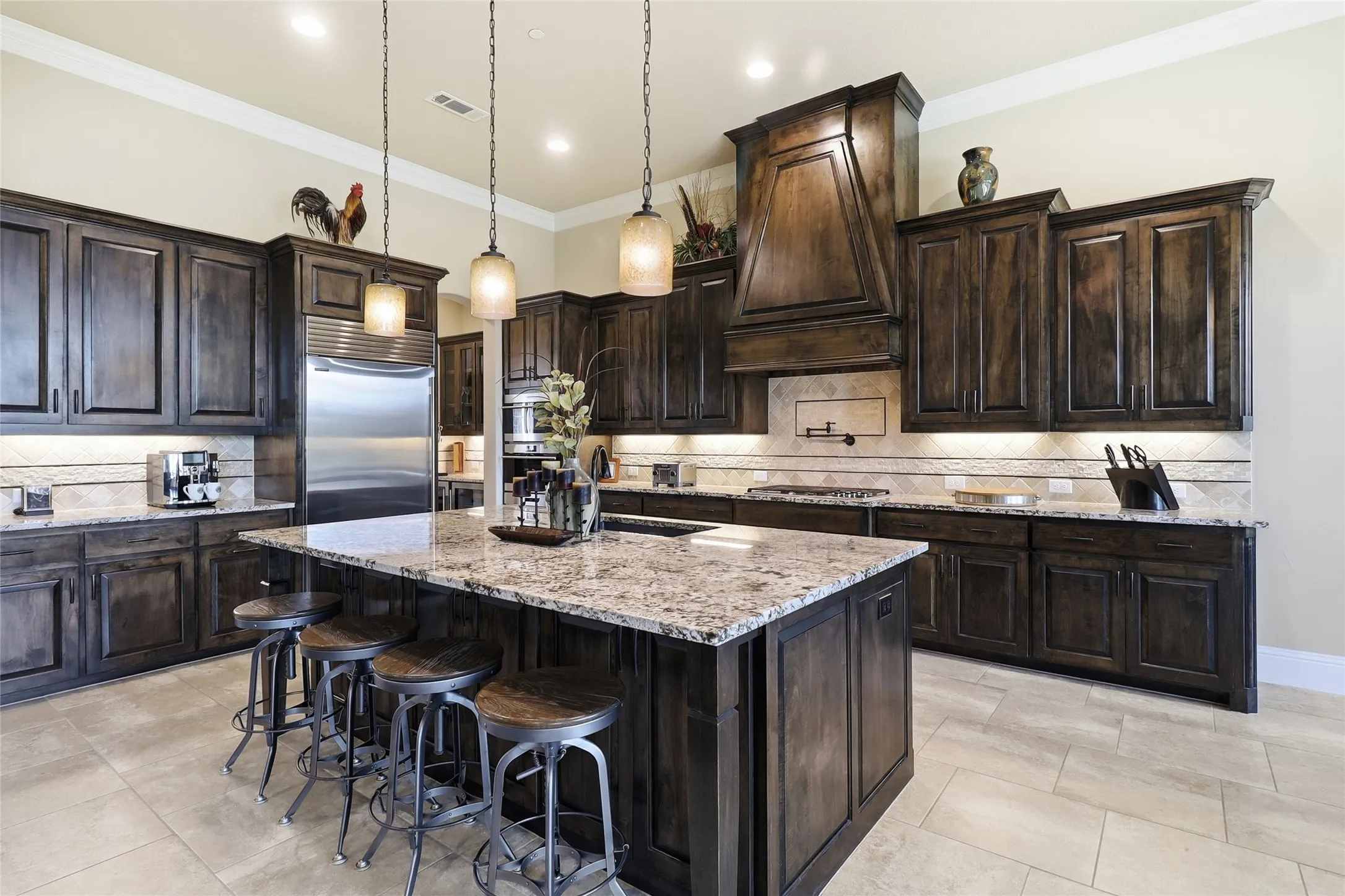 Light abounds in this gorgeous kitchen with its sleek stone countertops, premiums appliances, abundant storage, and a central island for easy meal preparation and effortless entertaining and family living.