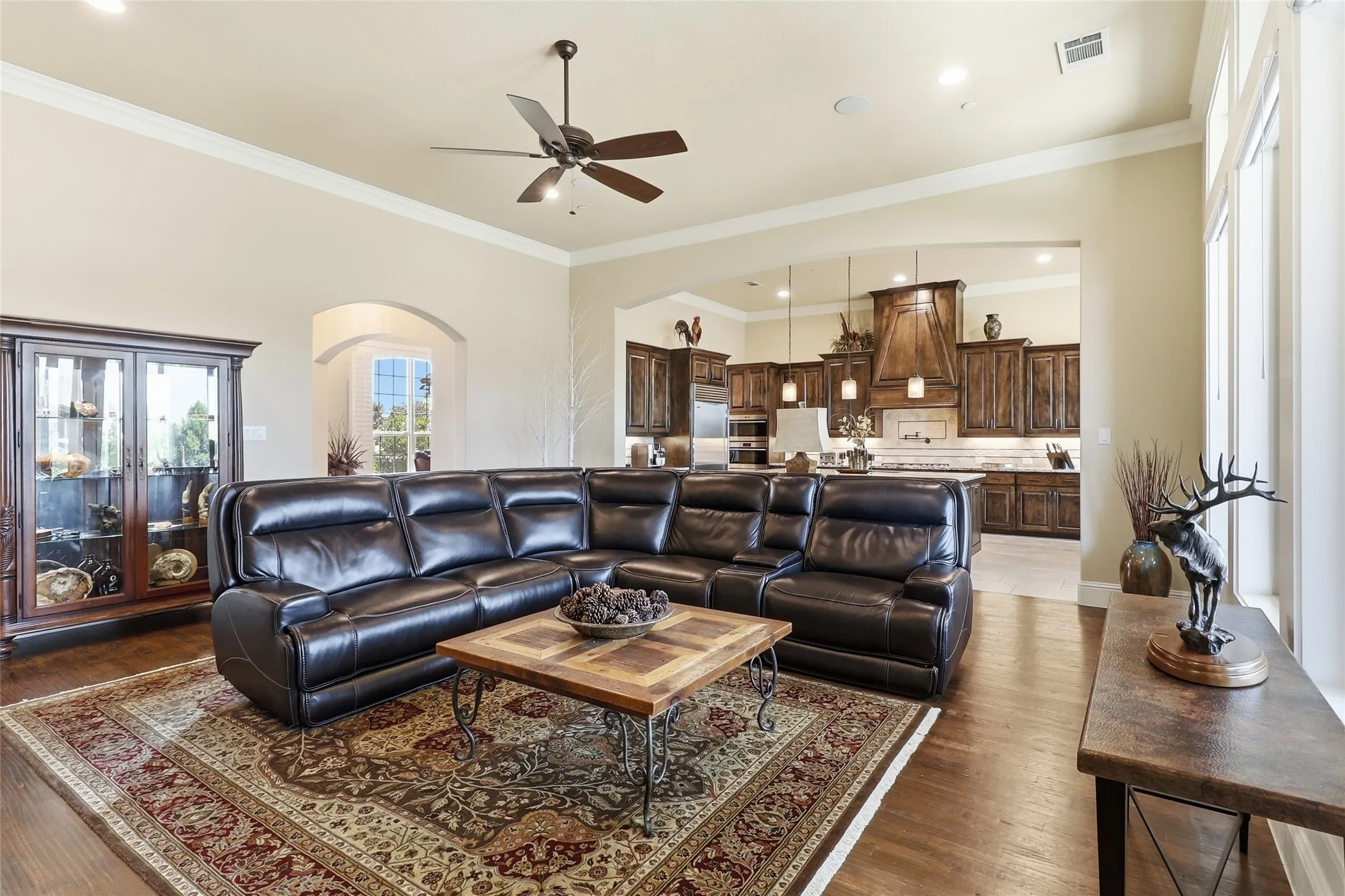 Large family room showcases abundant windows and is open to the kitchen for ease of family living or entertaining.