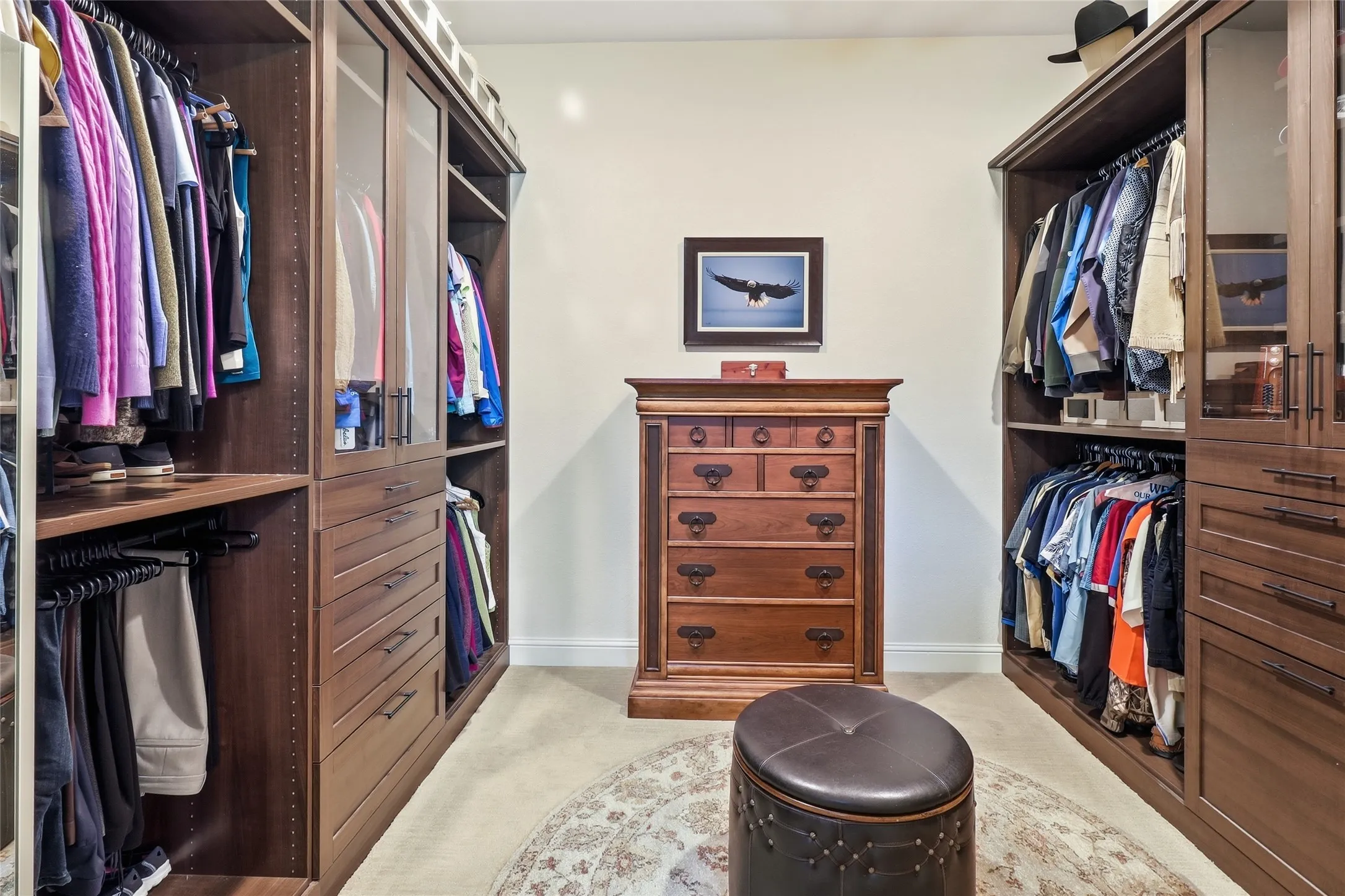 Spacious Primary Bathroom closet was custom-designed and installed with additional cabinets and drawers.