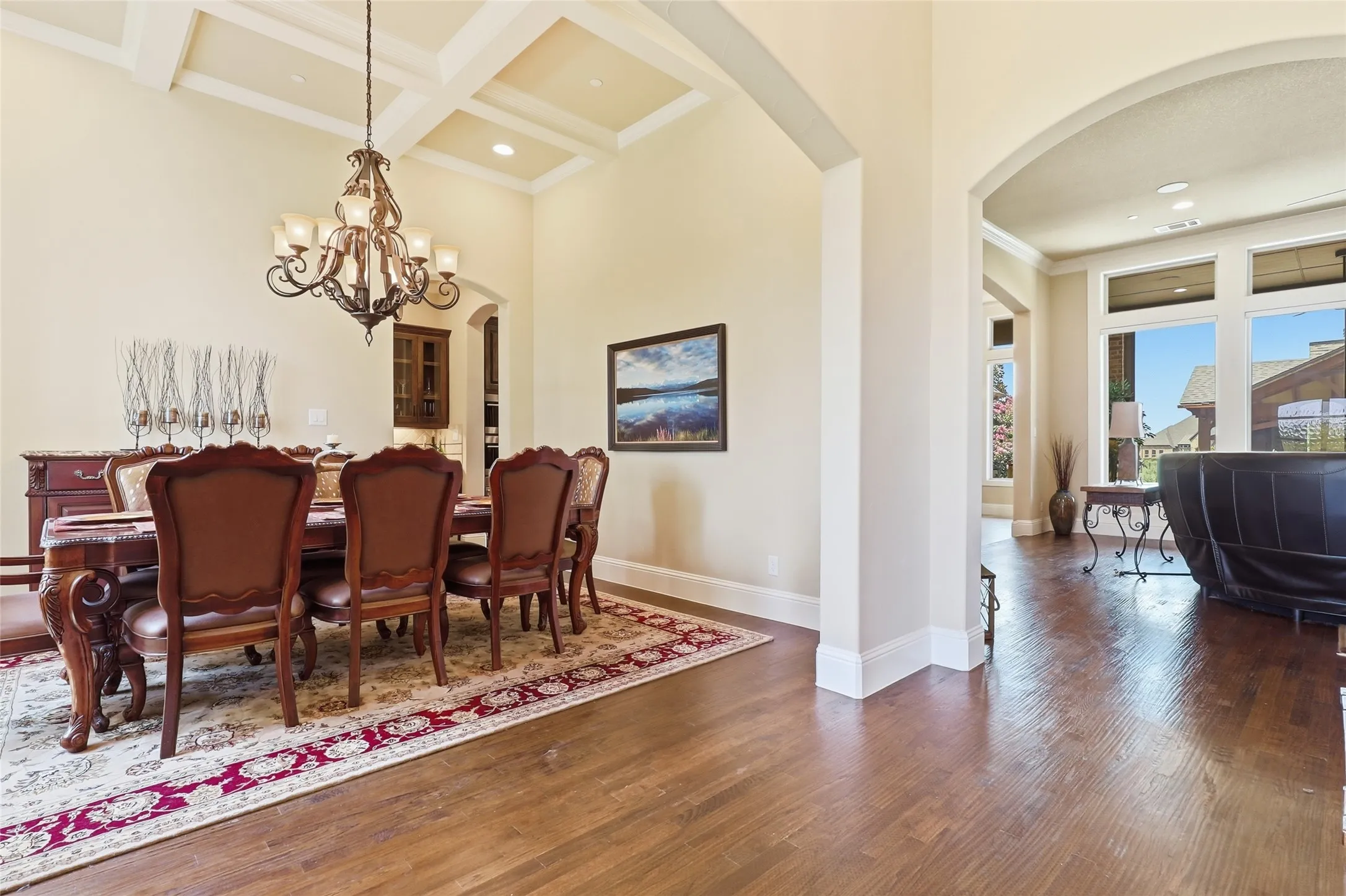 Formal dining is showcased by its custom ceiling treatment and entry to butler's pantry for dining experiences.