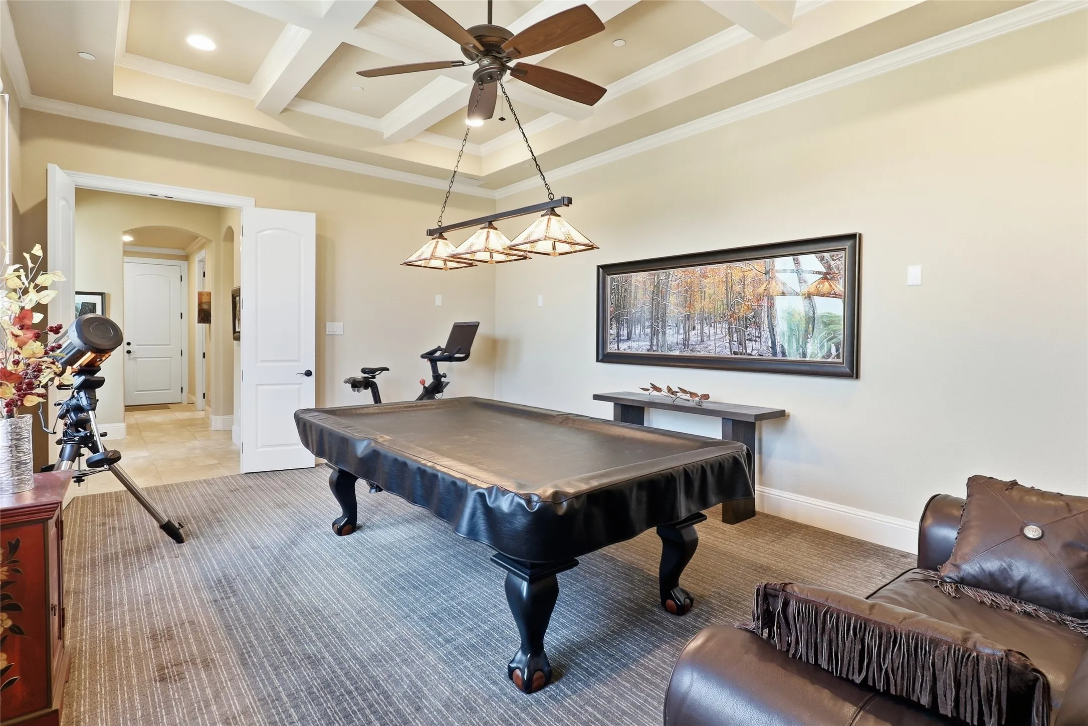 Oversized gameroom showcases custom ceiling treatment and is private for family fun or movie nights!