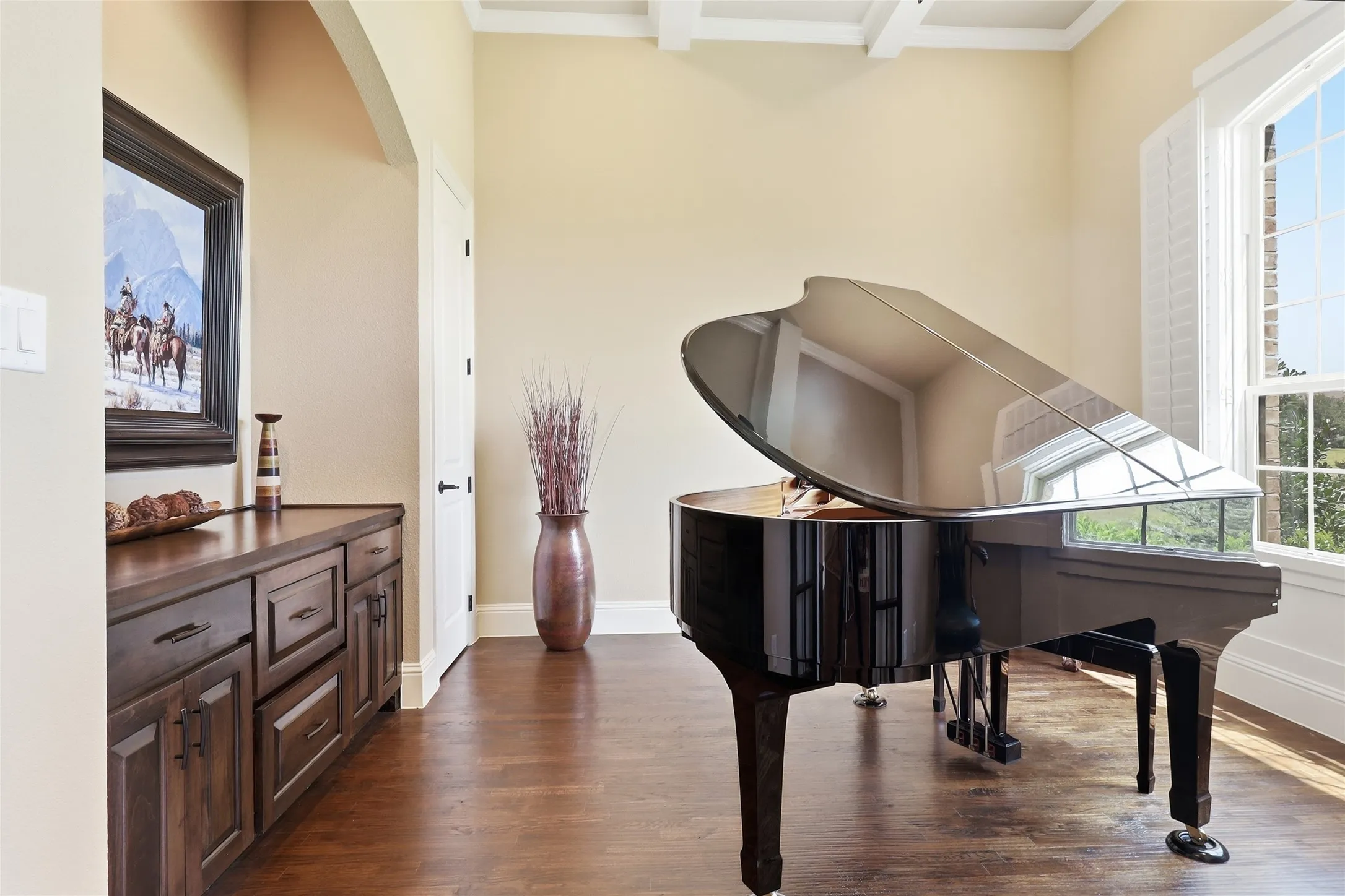 Multi-purpose room with its built-in cabinets and drawers is a multi-purpose room perfect for an at-home office or formal living space.