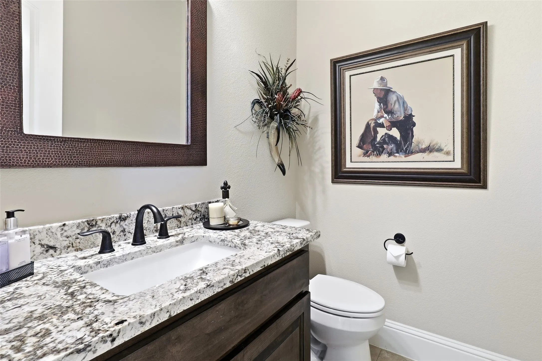 Powder bathroom adjacent to the gameroom.