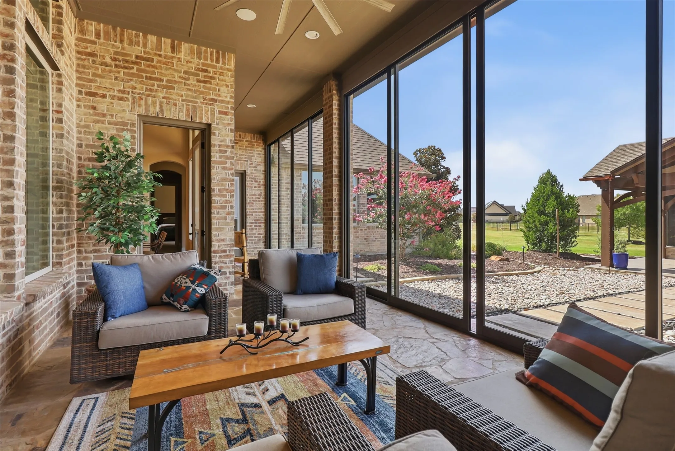 Visualize morning coffee or sunsets from this enclosed patio with floor-to-ceiling sliding doors and opening to this amazing home on 1.85 acres.