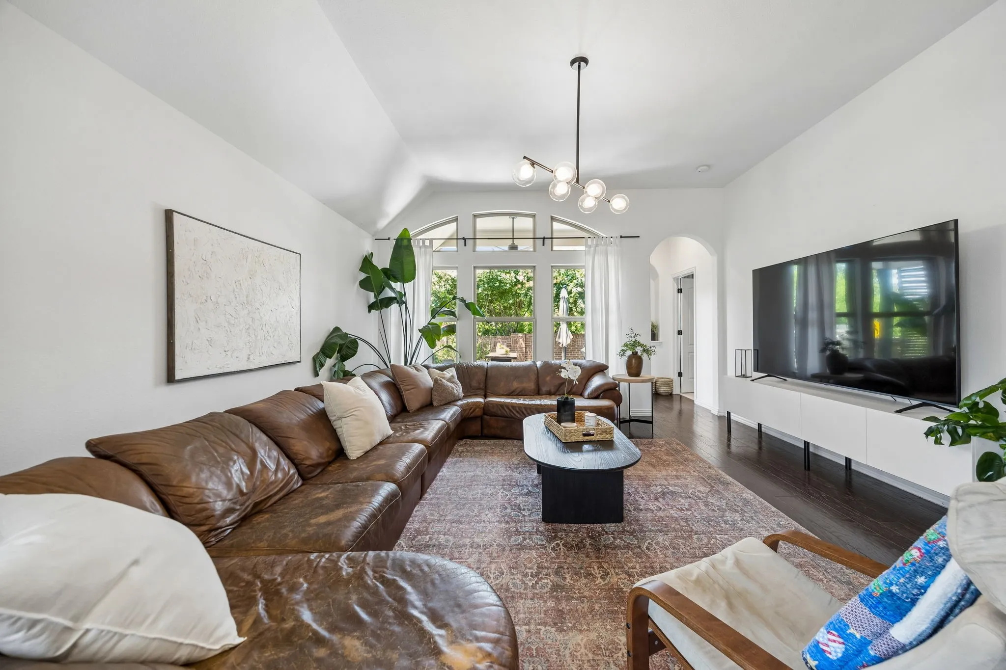 Flooded with natural light, this living room is large yet feels so cozy