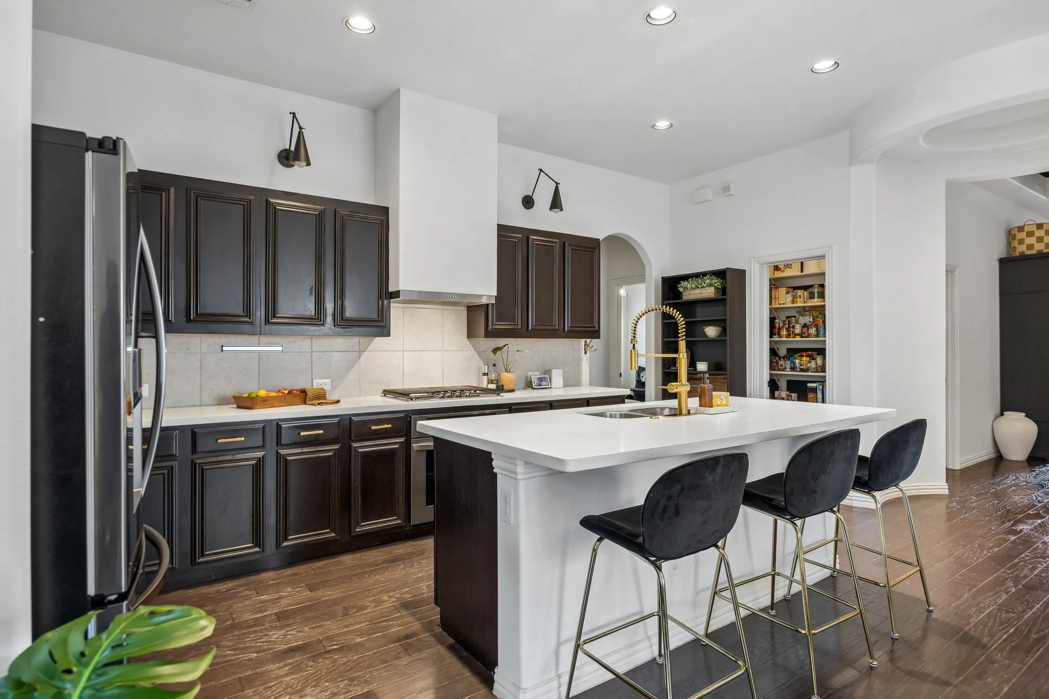Notice the oversized pantry and additional shelving for cutting boards and countertop appliances
