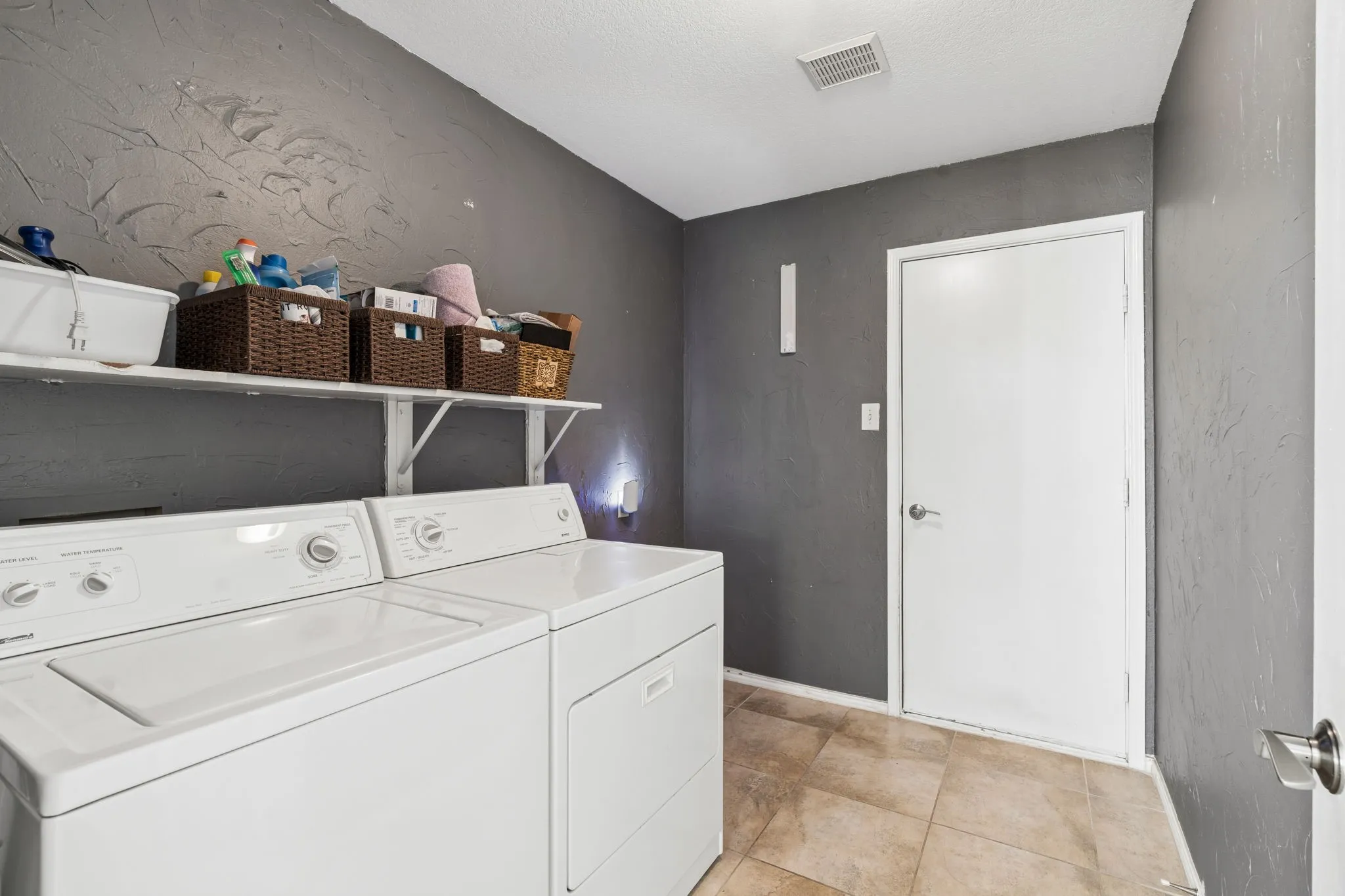Utility room with garage access.