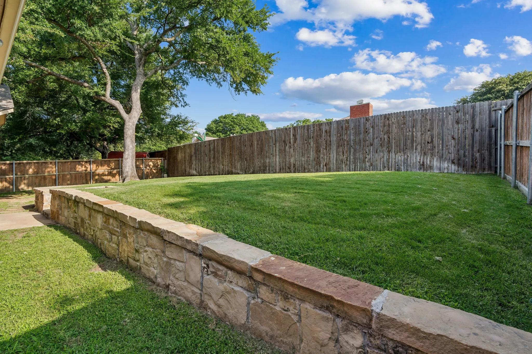 Grassy area great for kids or pets to enjoy.