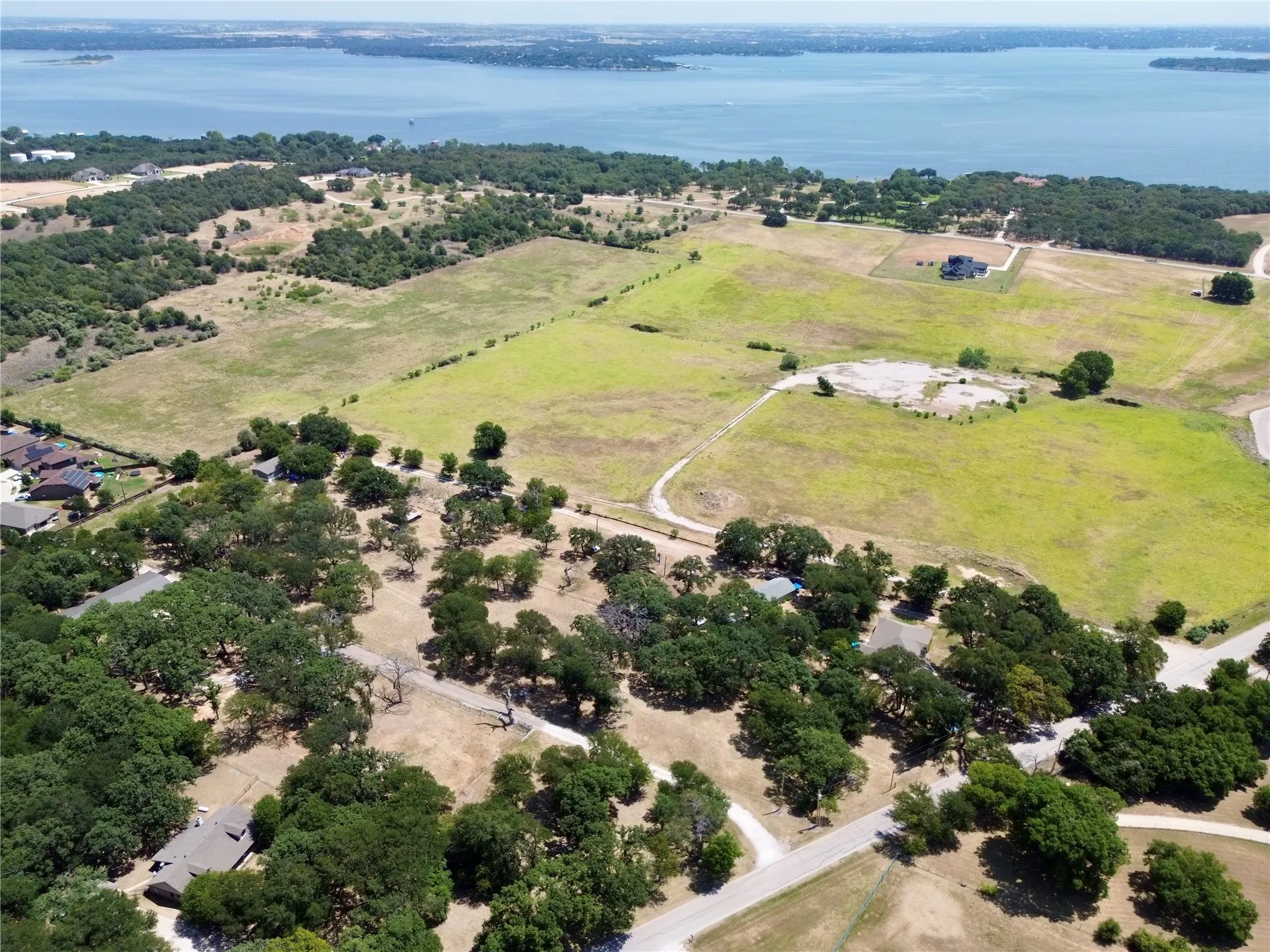 Expansive land parcels featuring established trees and open fields