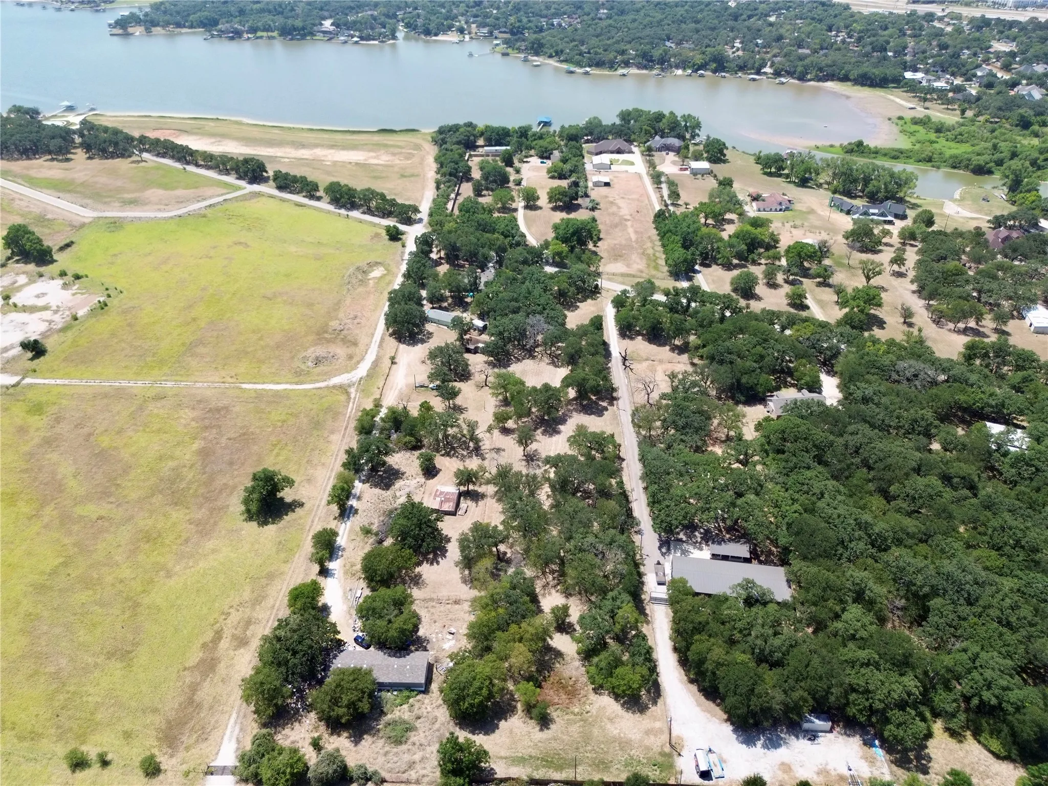 Expansive property featuring a combination of wooded areas and open fields