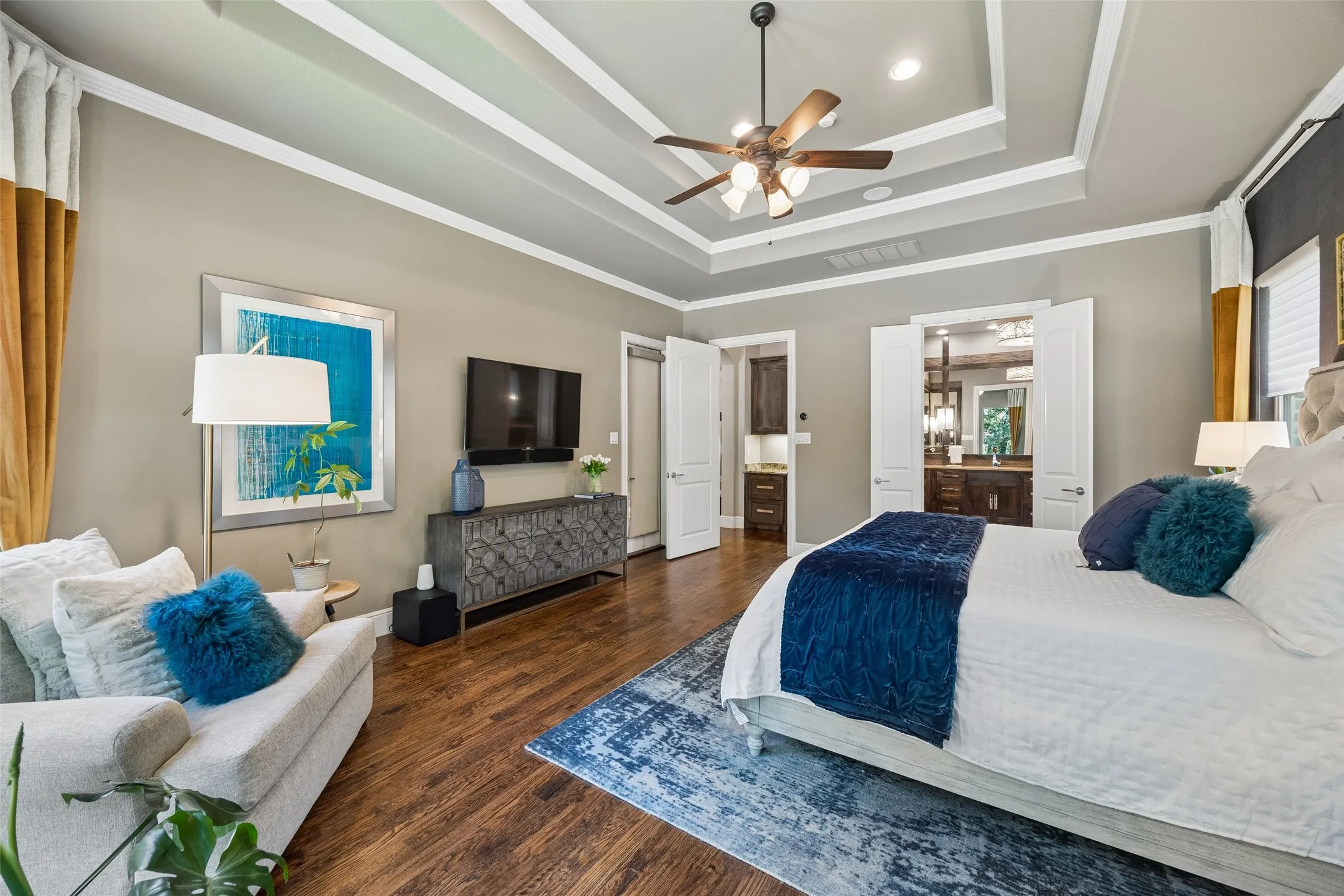 Coffer-style ceiling with a ceiling fan and recessed lighting