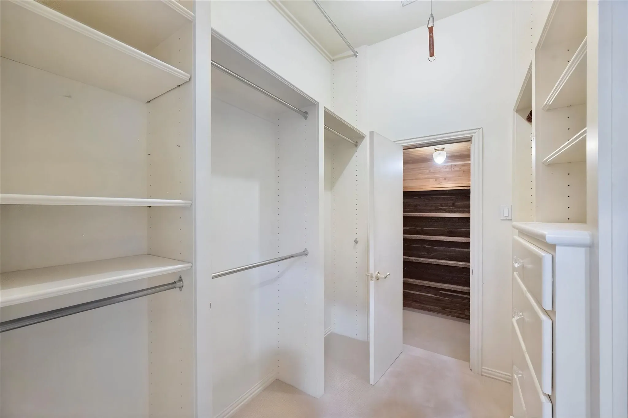 Walk in closet with adjoining cedar closet.