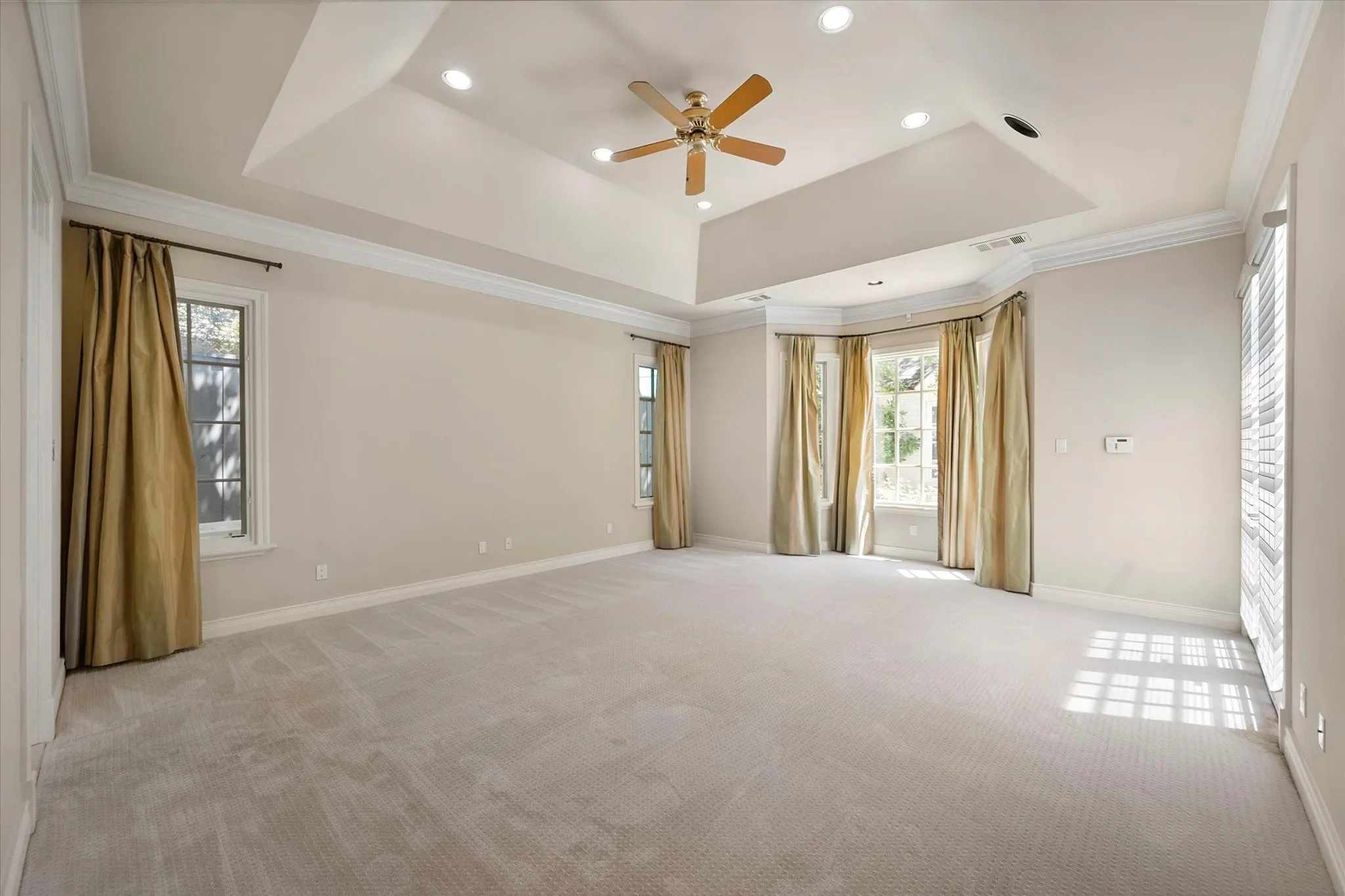 The spacious primary bedroom is very private from the other bedrooms and living space.