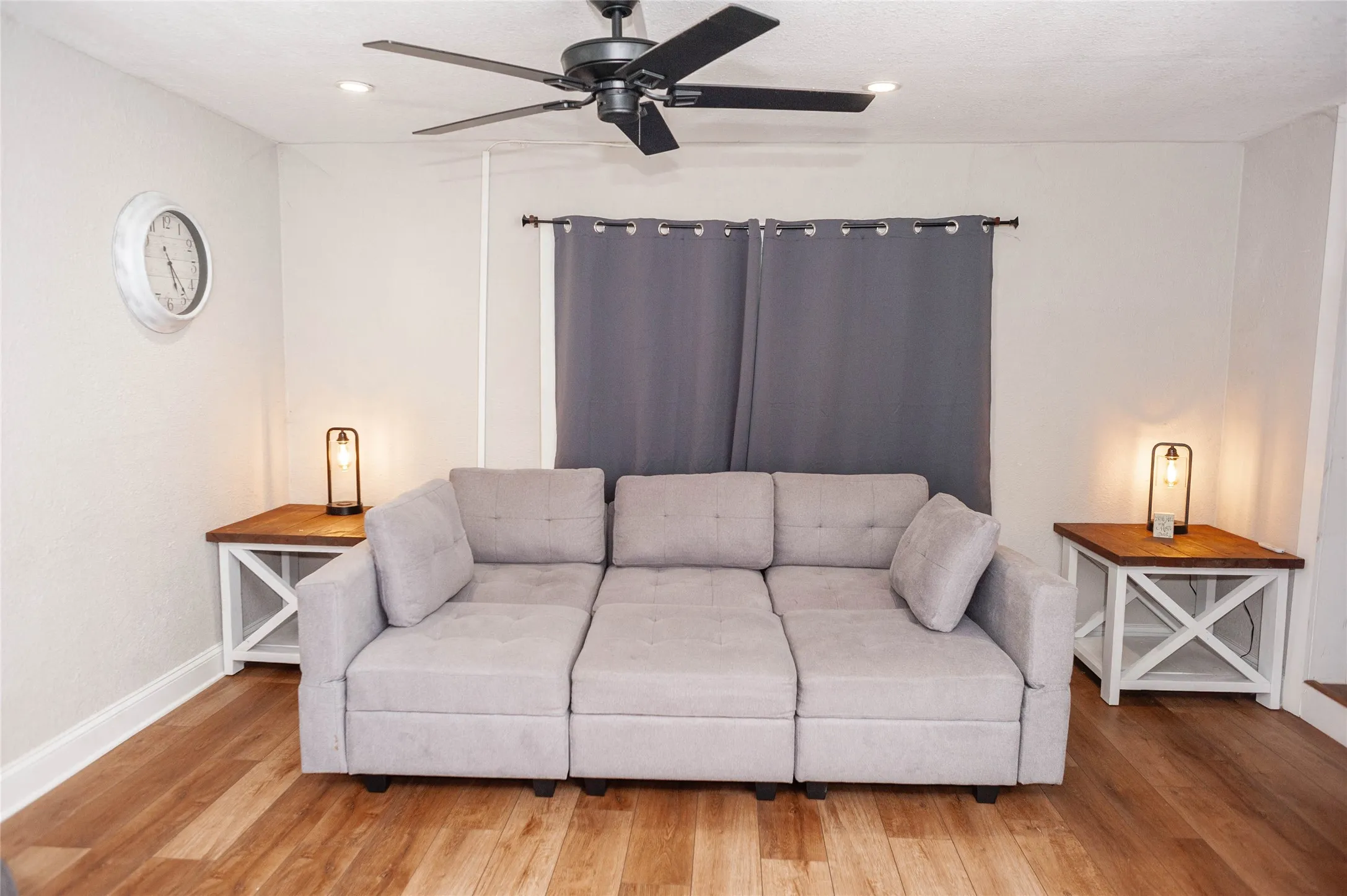Wood-finish flooring with crisp white baseboards