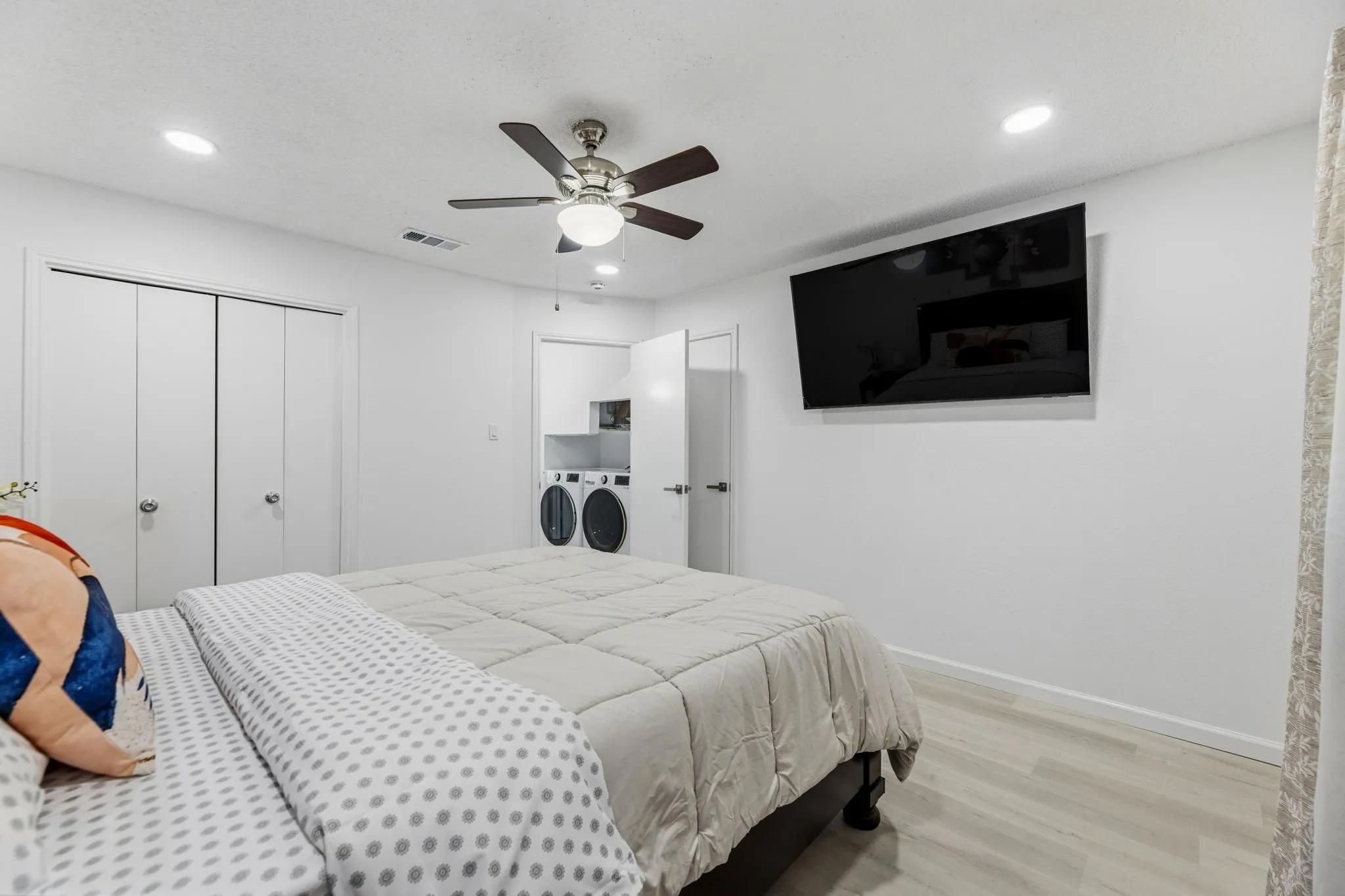 Bedroom featuring wood-finish flooring, recessed lighting, and a ceiling fan