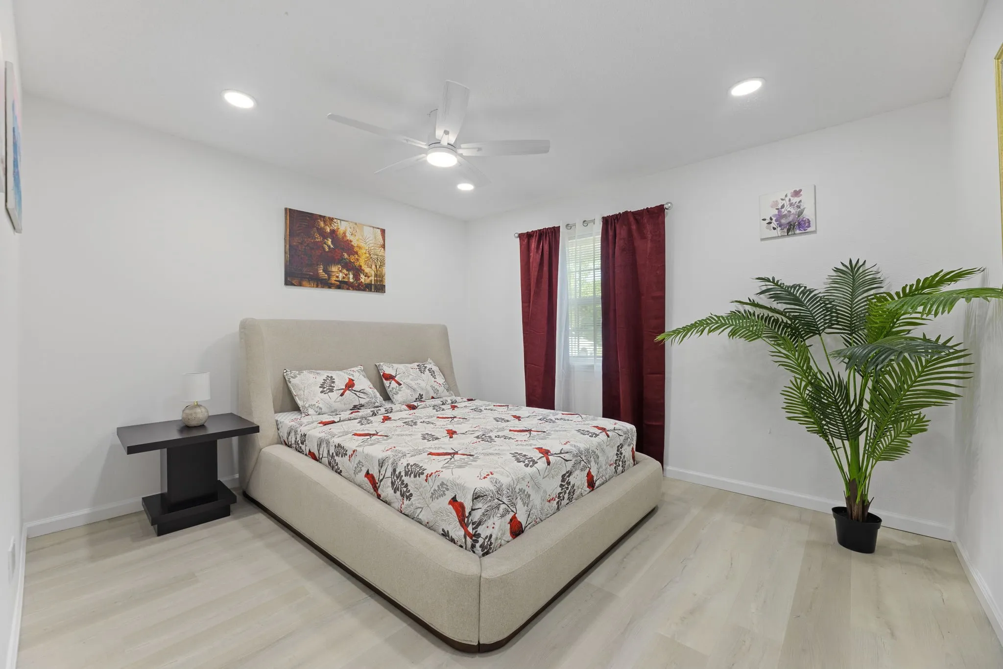 Bedroom featuring light wood-finish flooring, recessed lighting, and a ceiling fan