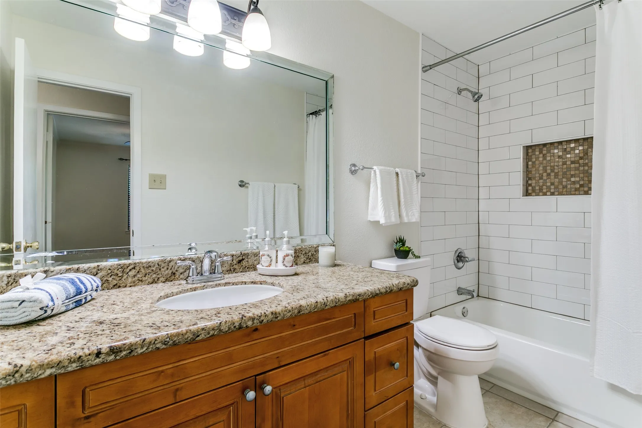 The upstairs bathroom has also been with new ceramic remodeled. The tub was replaced and the tiel suroound is new in 2026.