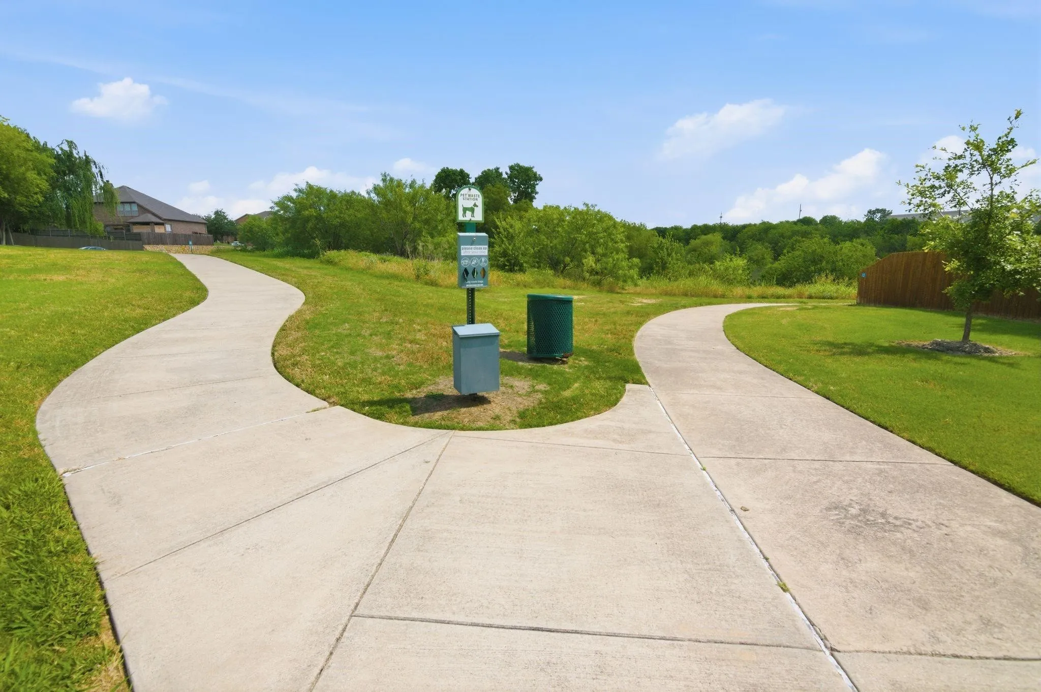 Paved walking paths traversing manicured green spaces
