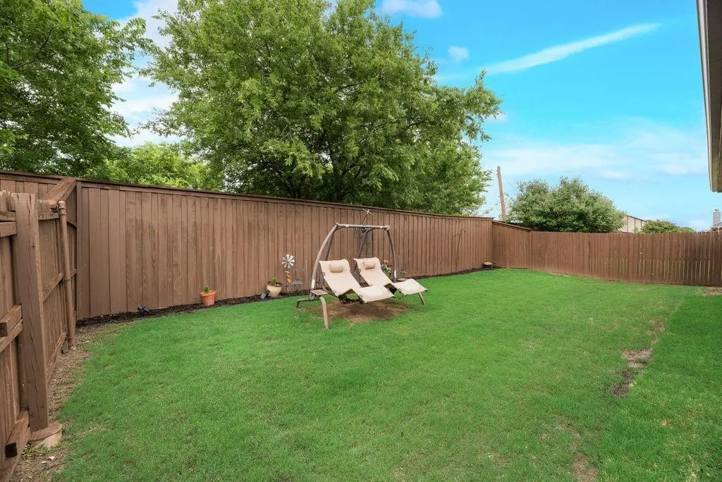 View of fenced backyard