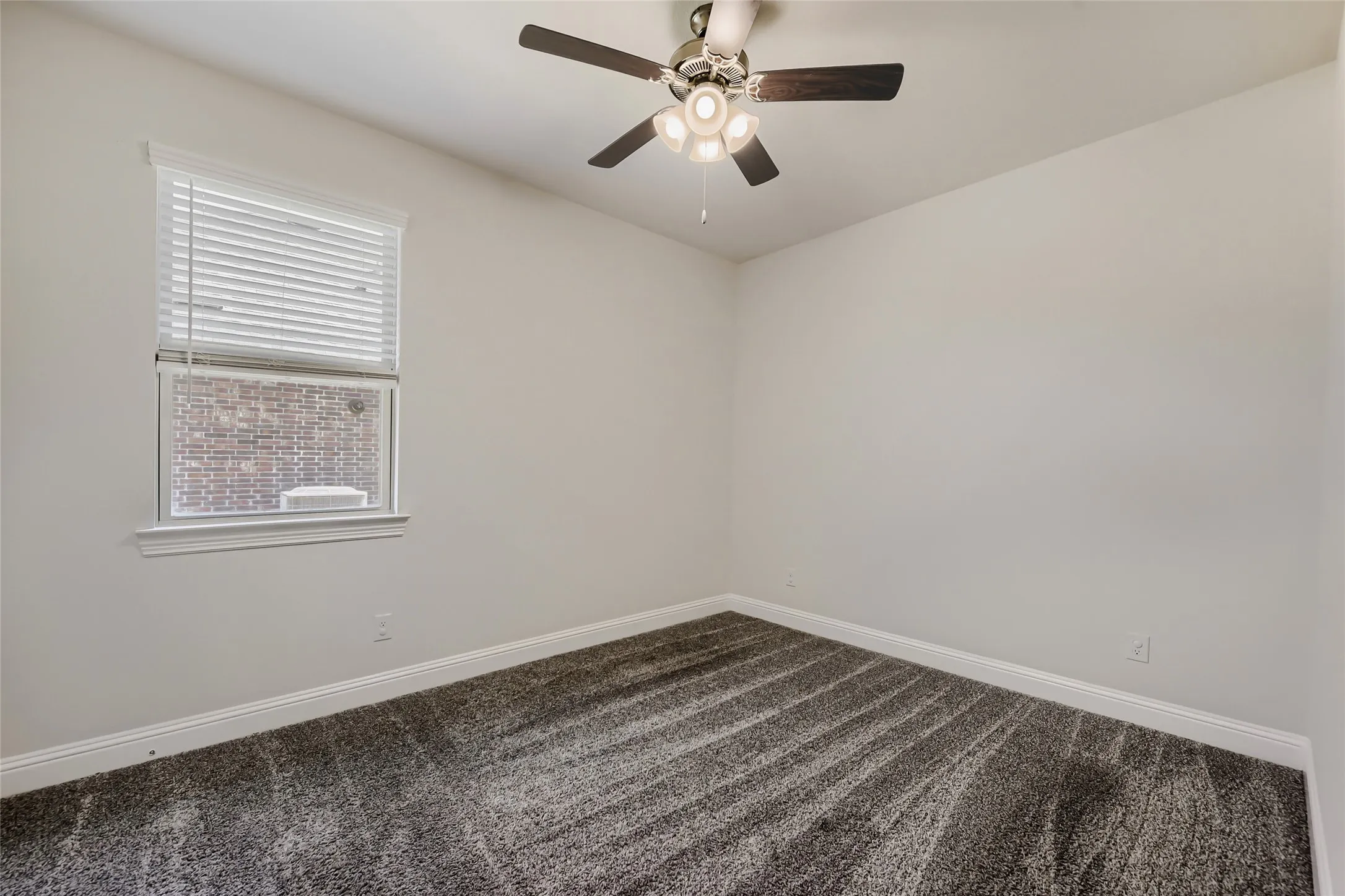 Neutral-toned room with plush patterned carpeting