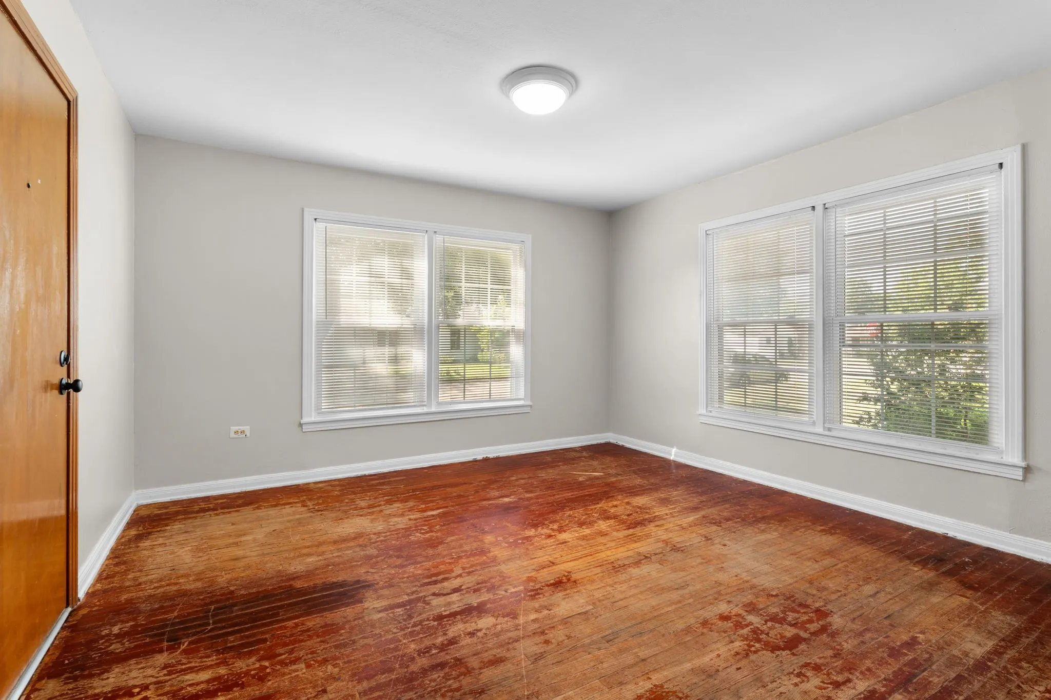 Bedroom with original hardwood flooring