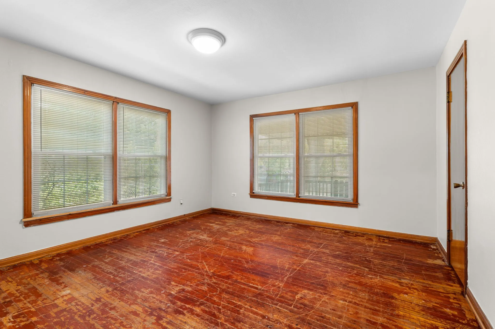 Bedroom with original hardwood flooring