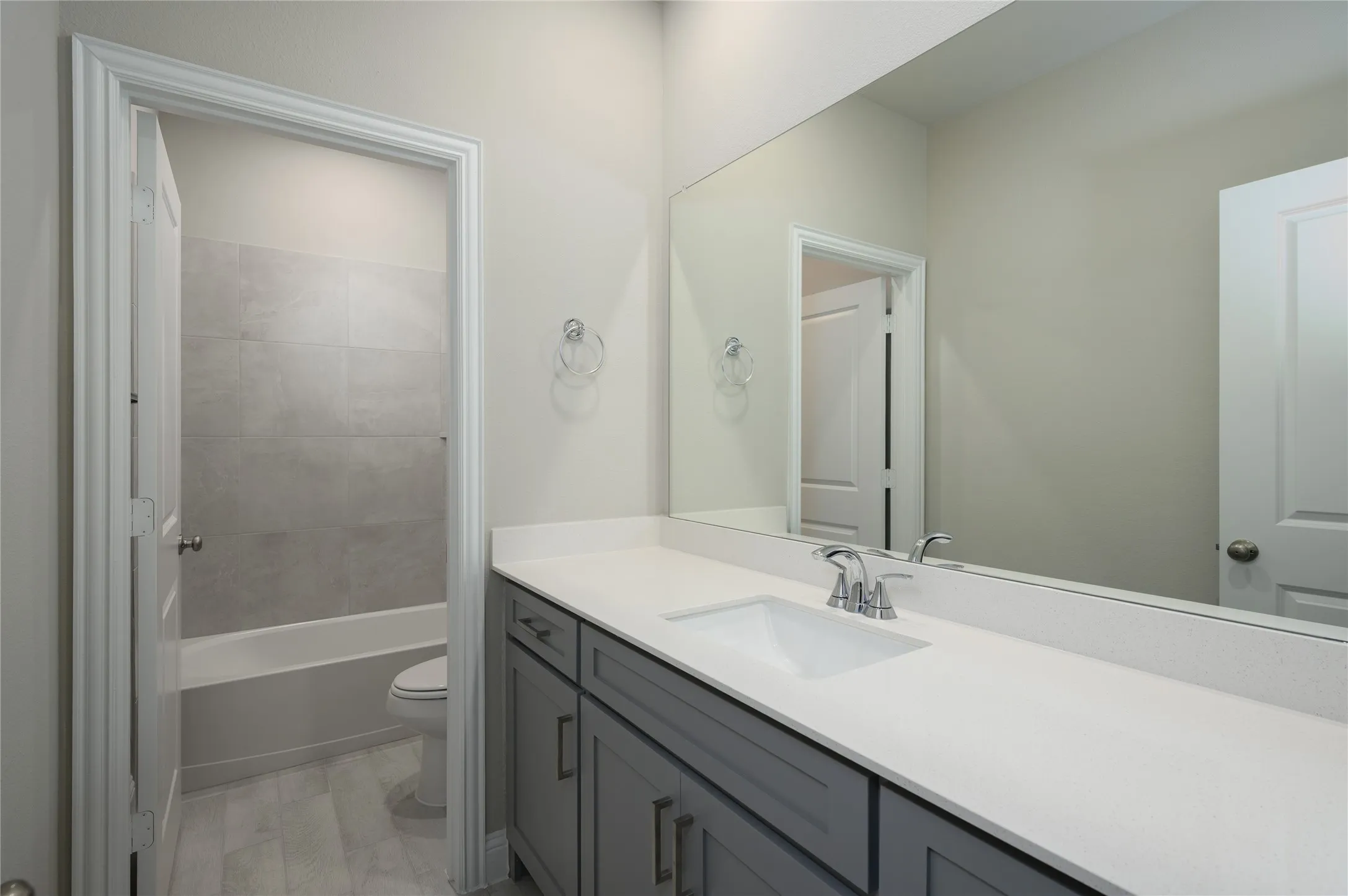 Full bath featuring toilet, shower / tub combination, and vanity