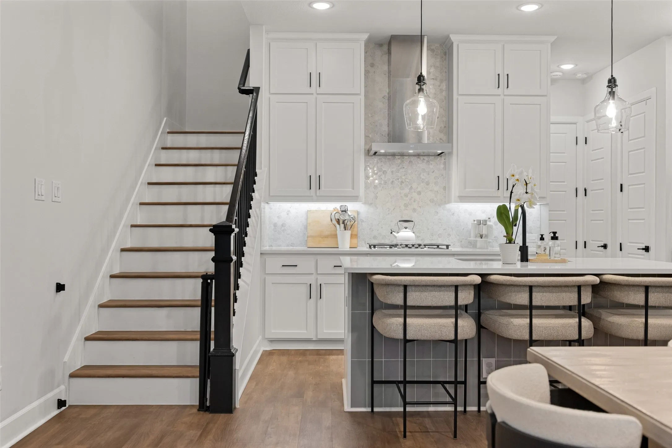 Heading up to the second level, you'll notice the high-end craftsmanship and attention to detail that continues throughout the home