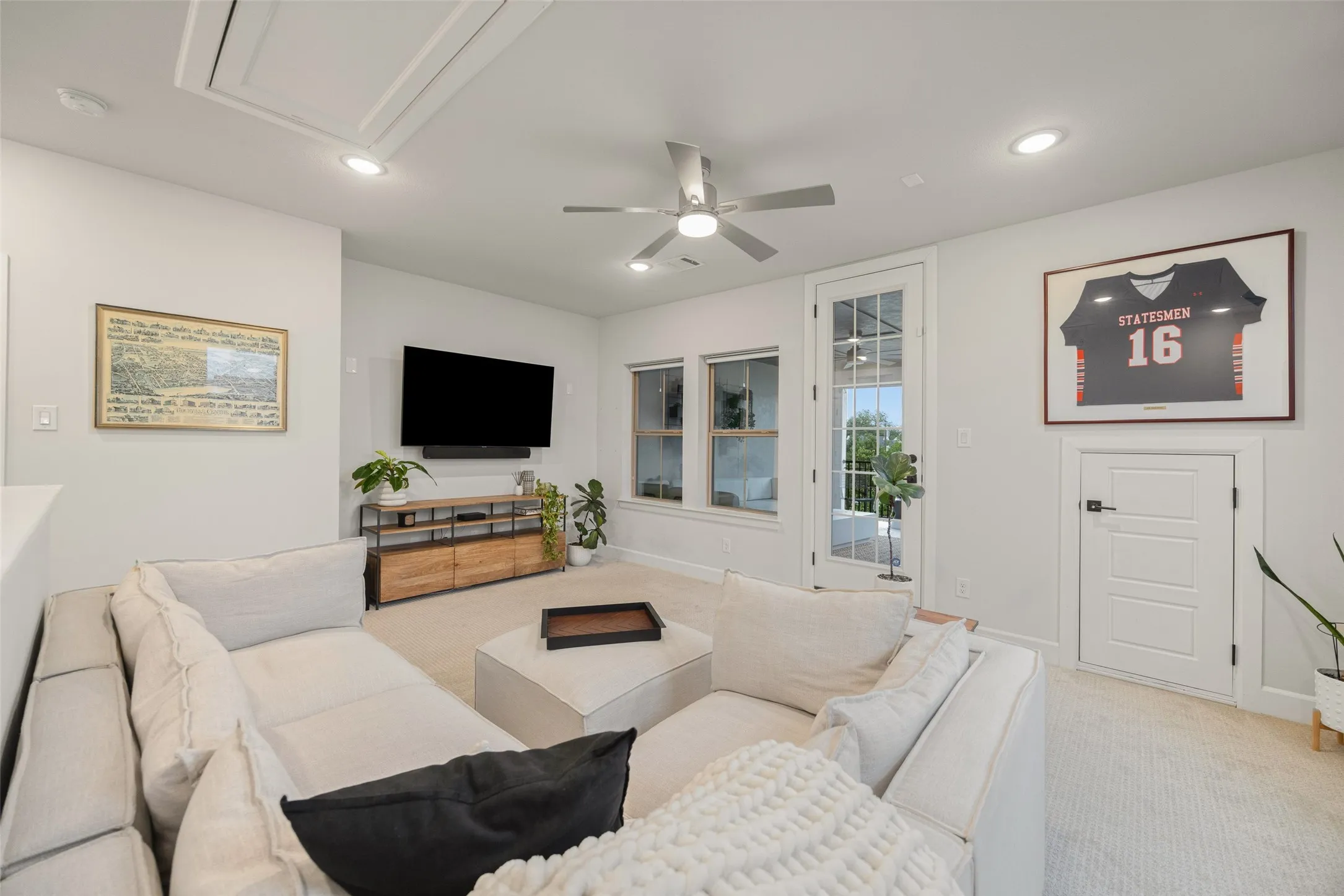 The bonus room feels bright and open, serving as the gateway to your private outdoor retreat