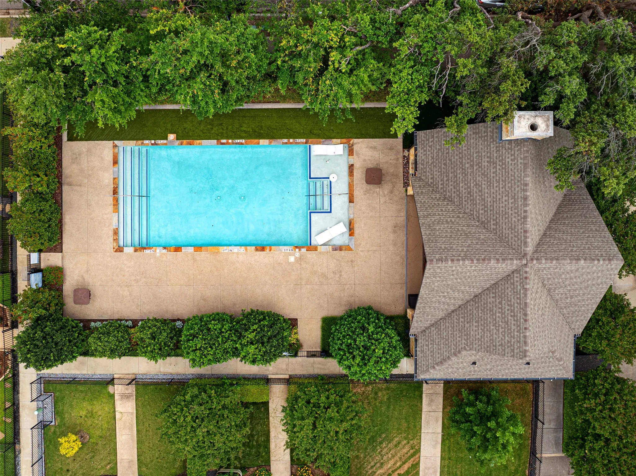 Residents here enjoy the Oak Park swimming pool, a peaceful spot to spend a sunny afternoon