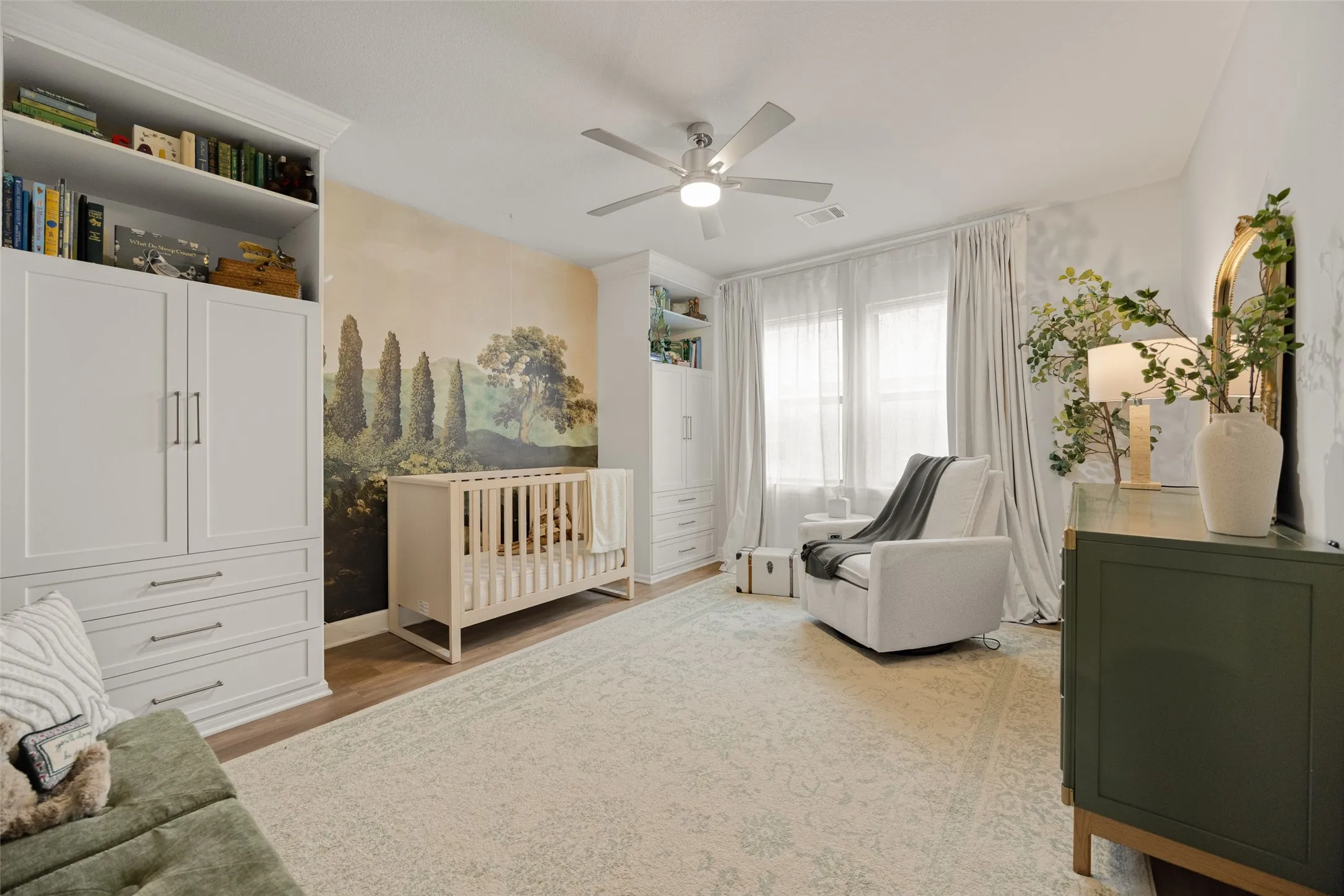 Beyond the beautiful mural, this room features its own walk-in closet and a full ensuite bath for complete privacy